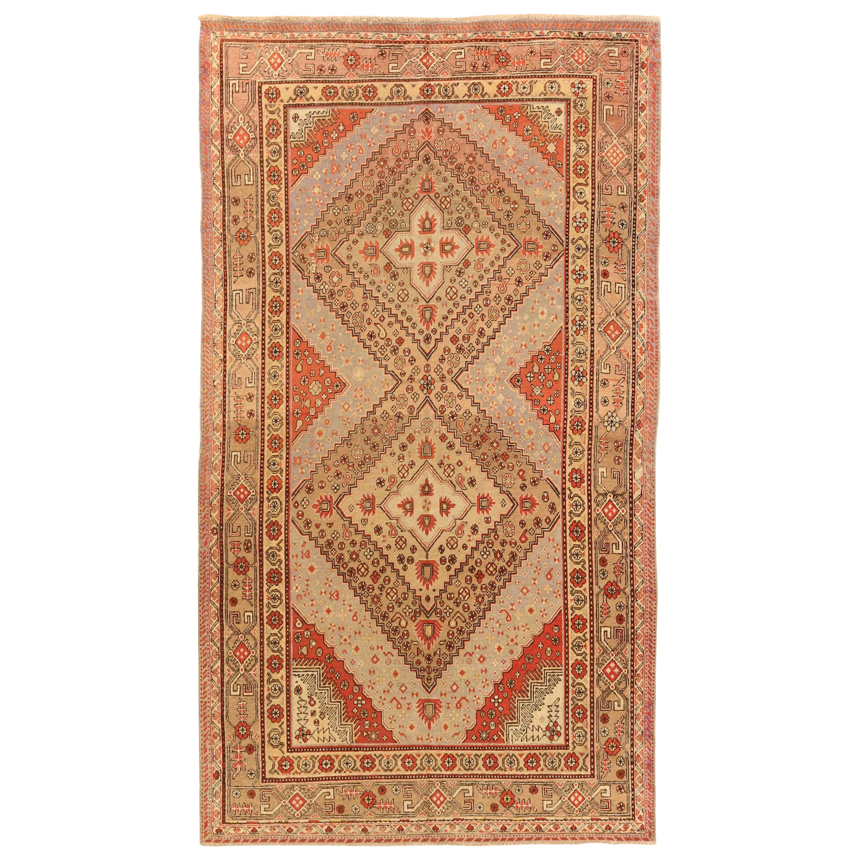 1950s Antique Central Asian Rug Khotan Style with Elaborate Floral Motif For Sale