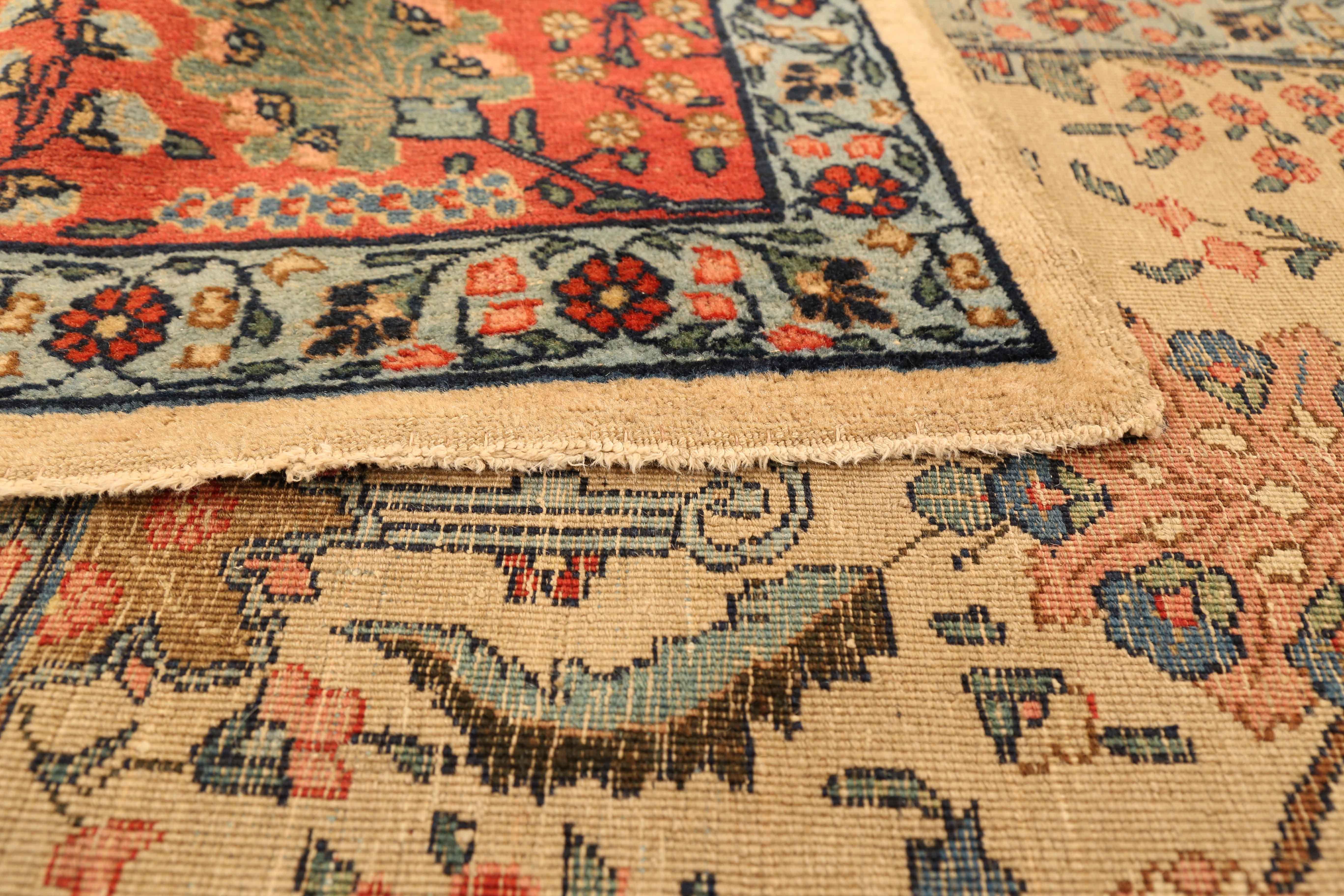 Antique Persian rug handmade in the 1950s. Weavers used fine and exquisite wool colored with rich all-organic vegetable dyes. It follows a traditional style rooted in the Classic designs of world-famous Safavid carpets which were created in many