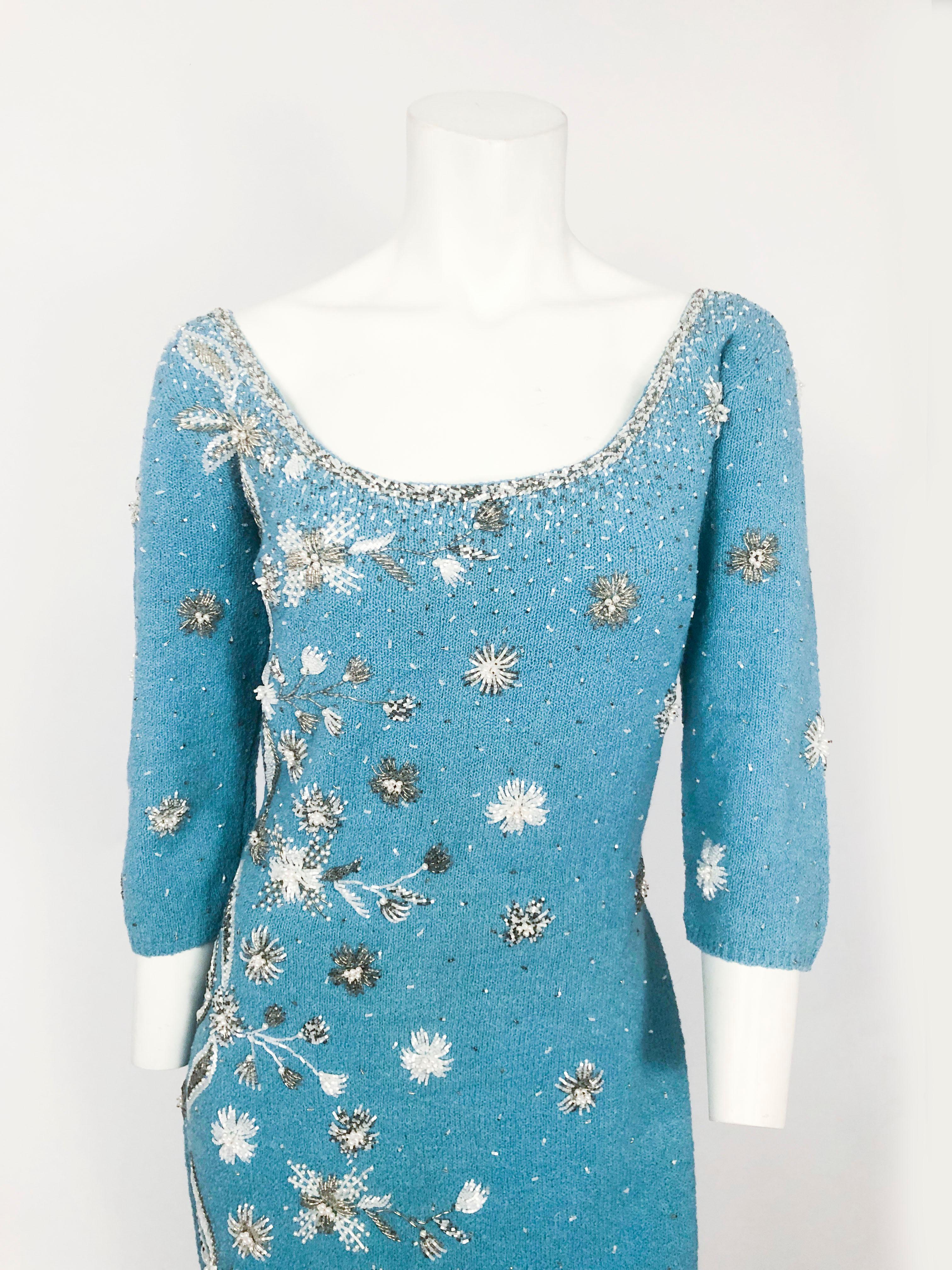 1950s Aqua Knit Dress with Hand Beading Accents that form floral and dot patterns. Scoop neckline, 3/4 sleeves, and partial lining on the inside