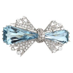 1950s aquamarine and diamond bow brooch in 18kt white gold and platinum