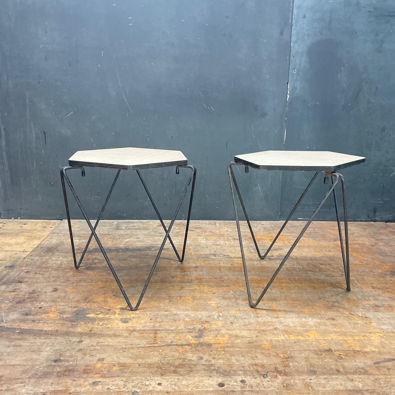 A wonderful pair of bent iron rod and plywood/micarta side tables.  In the style of Gio Ponti, Cohen & Pratt, with similar construction to Vista of California pieces. But, designer remains unknown.  

W 16.5 x H 16 in. / Stacked H 18.5 in.
