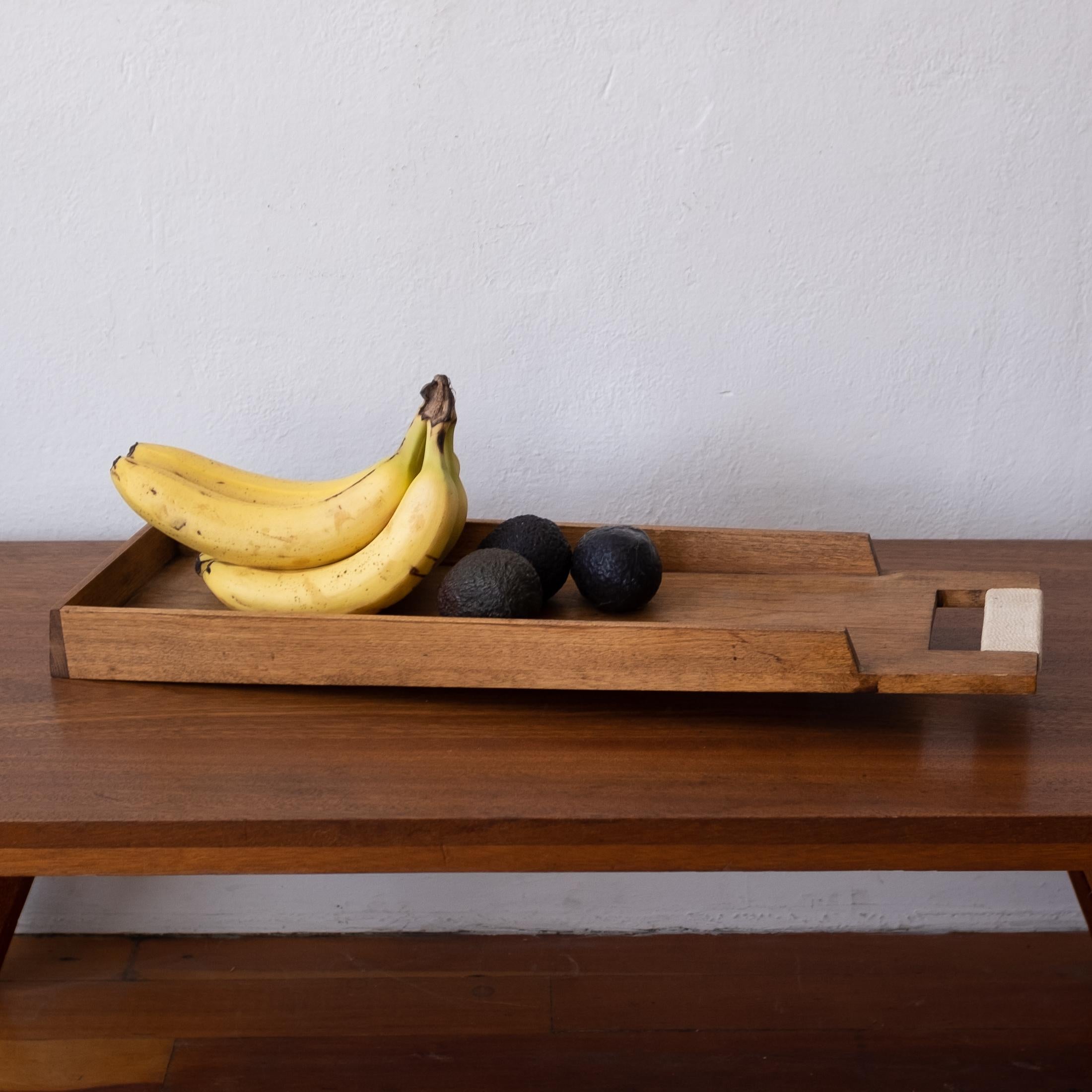 Midcentury wood catch all or fruit bowl with a string-wrapped handle. Architectural form with nice detailing.