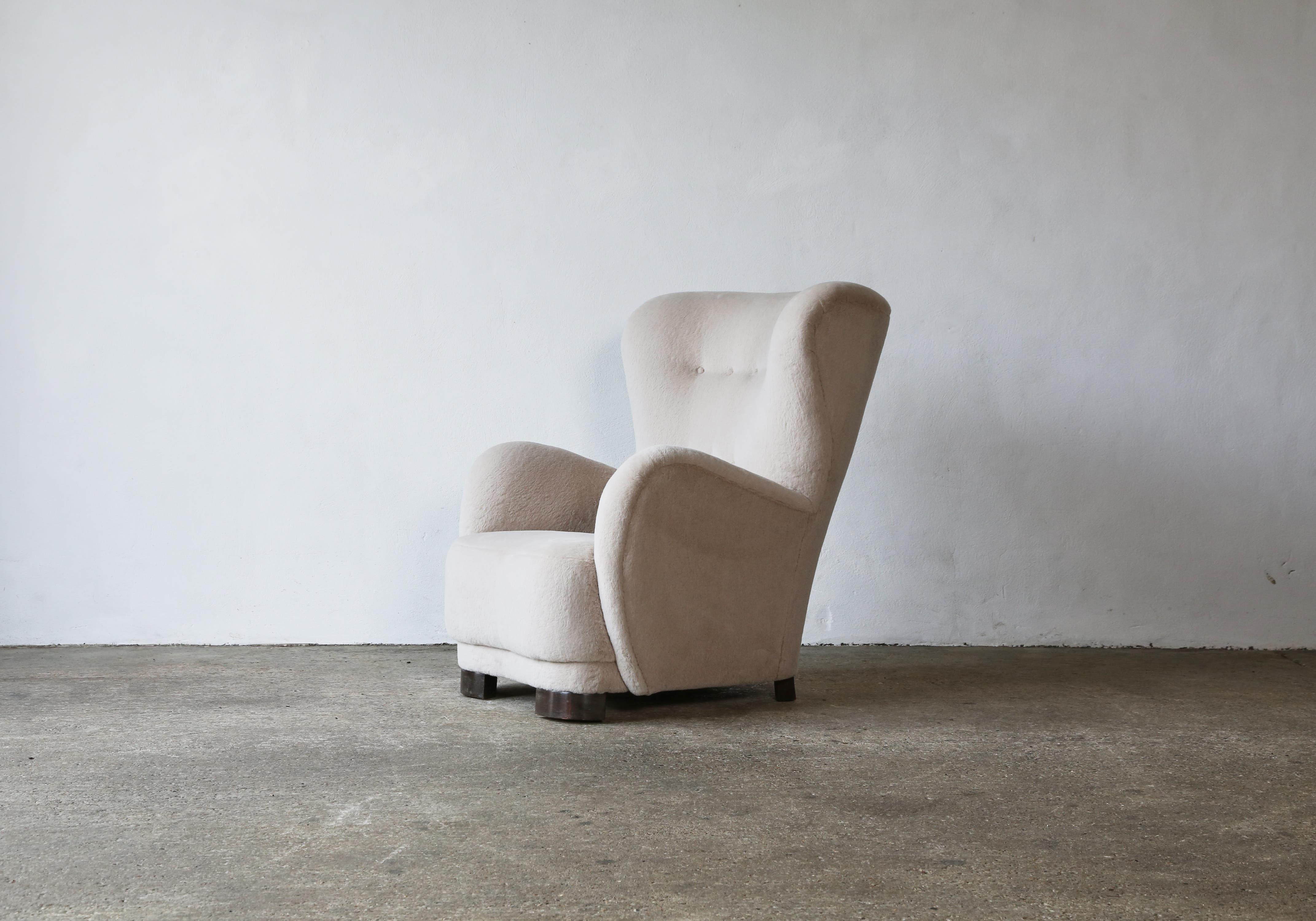 A wonderful, comfortable and substantial armchair, Denmark, 1950s. Newly upholstered in a premium, soft, ivory pure alpaca wool. Fast shipping worldwide.
  


UK customers please note: Prices do not include VAT.