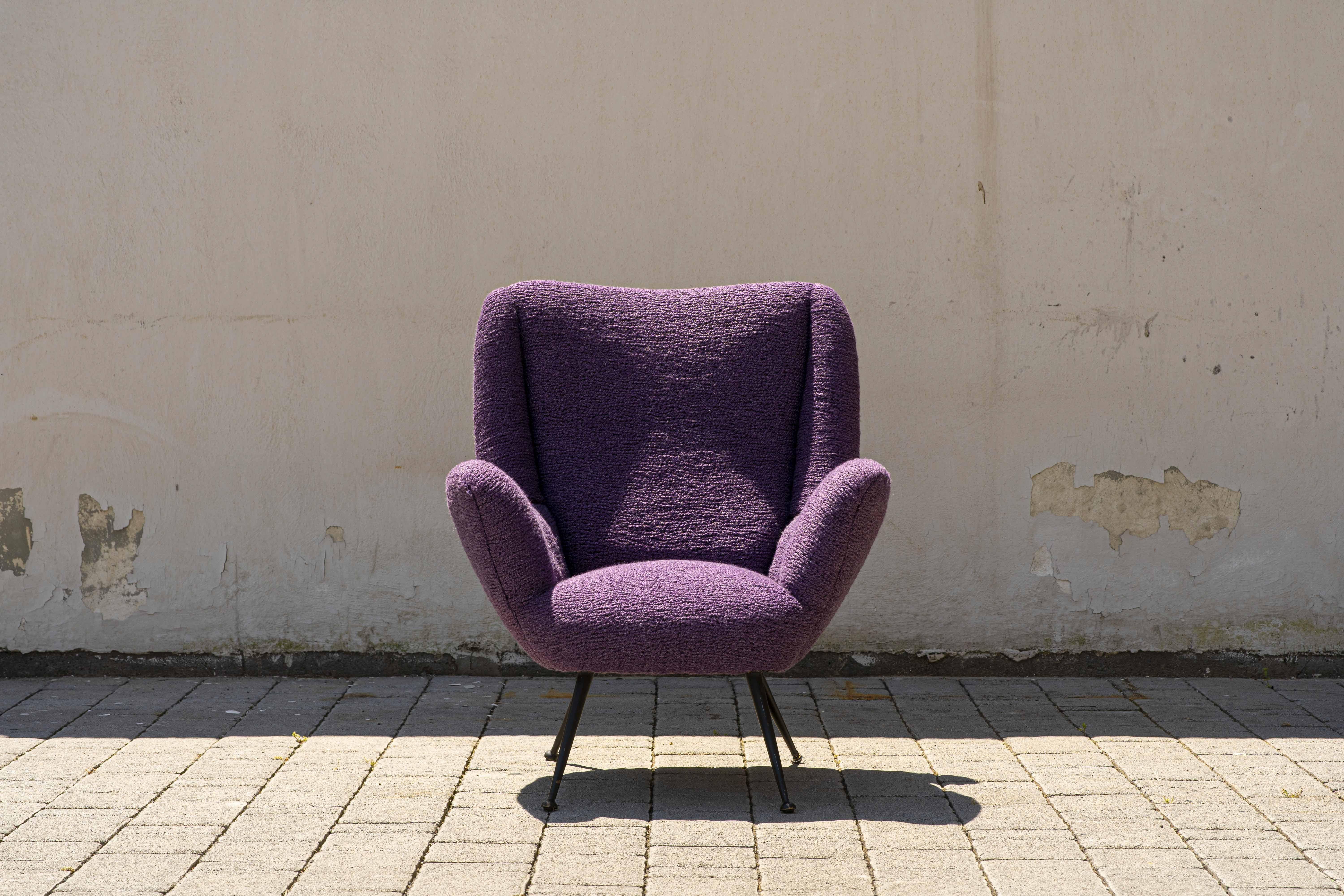 Small armchair for bedroom or living room, 1950s, lavender-coloured bouclé wool. Contemporary black brass feet. Suitable for any environment, its vivid colour will add a touch of colour to any room in your home. 

The armchair fabric is signed