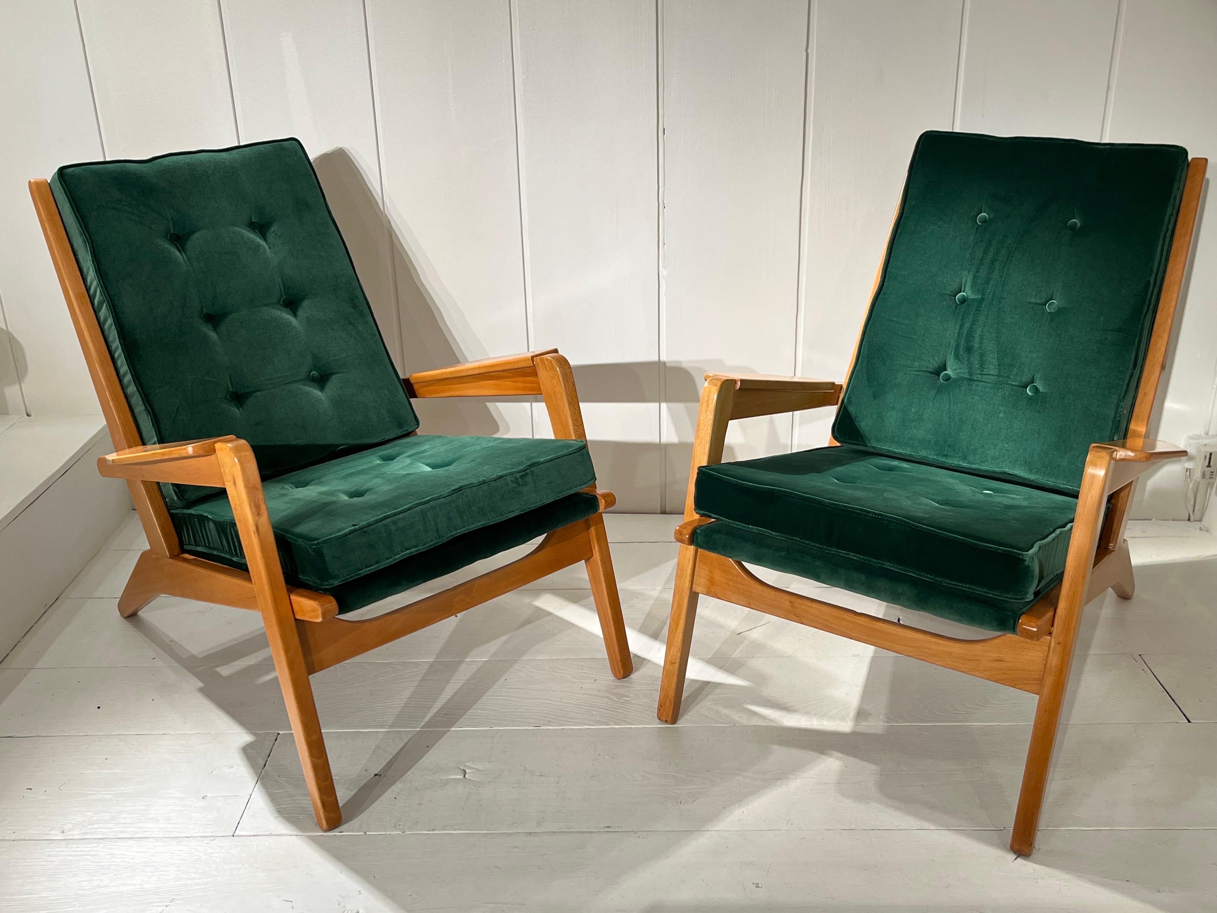 Pair of armchairswith light wood and green cotton velvet by Pierre Guariche
Great condition
New reuphostered with green velvet by Gaston & Daniela 
Original free spam sistem on the back.
  