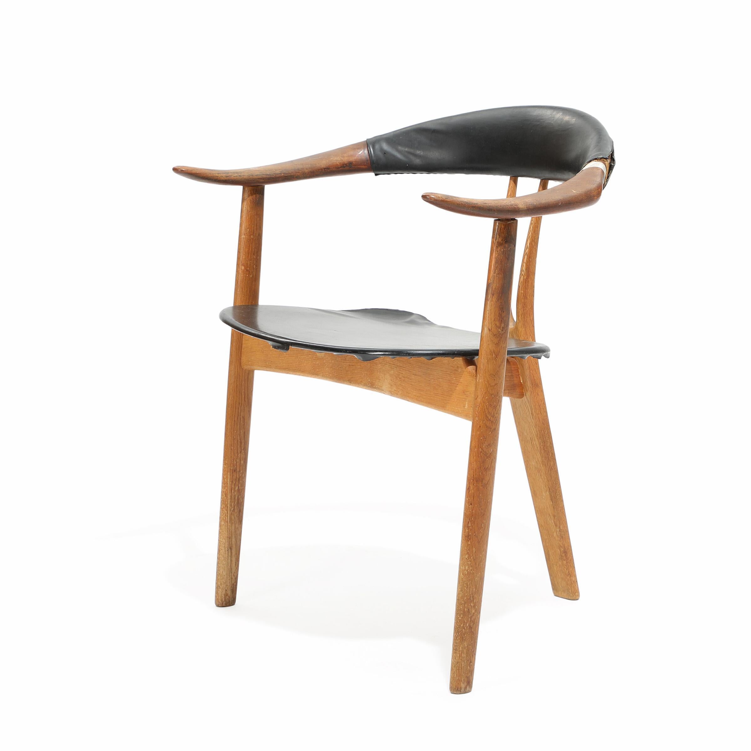 1950s Arne Hovmand-Olsen rare model 408 three legged bullhorn armchair, with solid teak frame, seat upholstered with original black leather. Designed around 1956 and manufactured by Master Carpenter Mogens Kold in the late 1950s. H: 74 W: 64 Seat