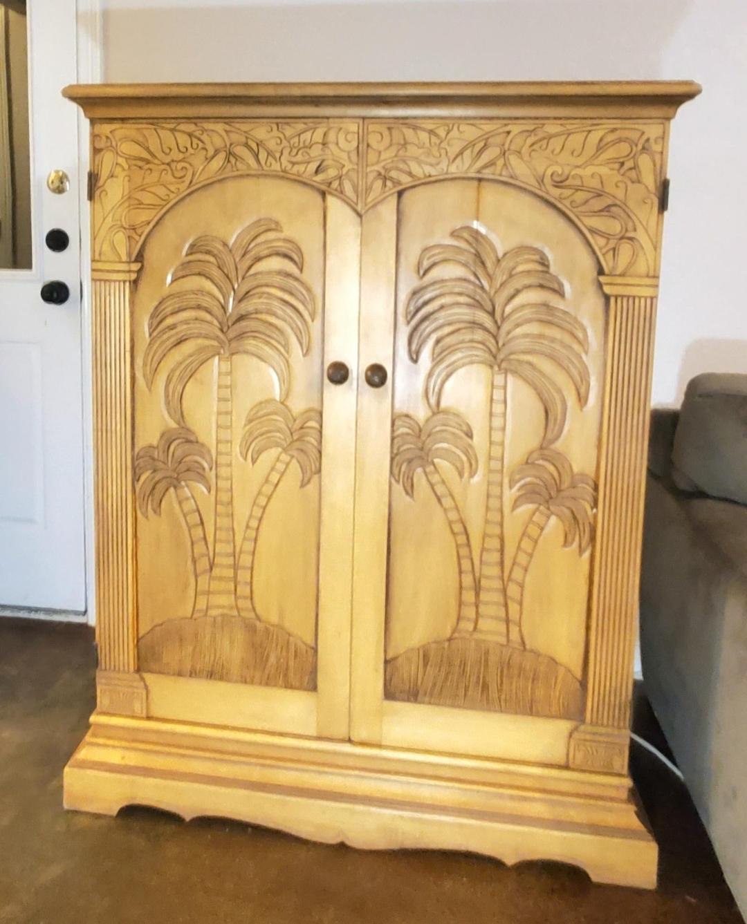 Hand carved on the front, sides and top.
Hand carved knobs.
There's even details in the shelves that slide out.
Intricate dovetails I've never seen before.
Solid wood, not veneer.
Shelves slide all the way out.
Doors open and fold to the