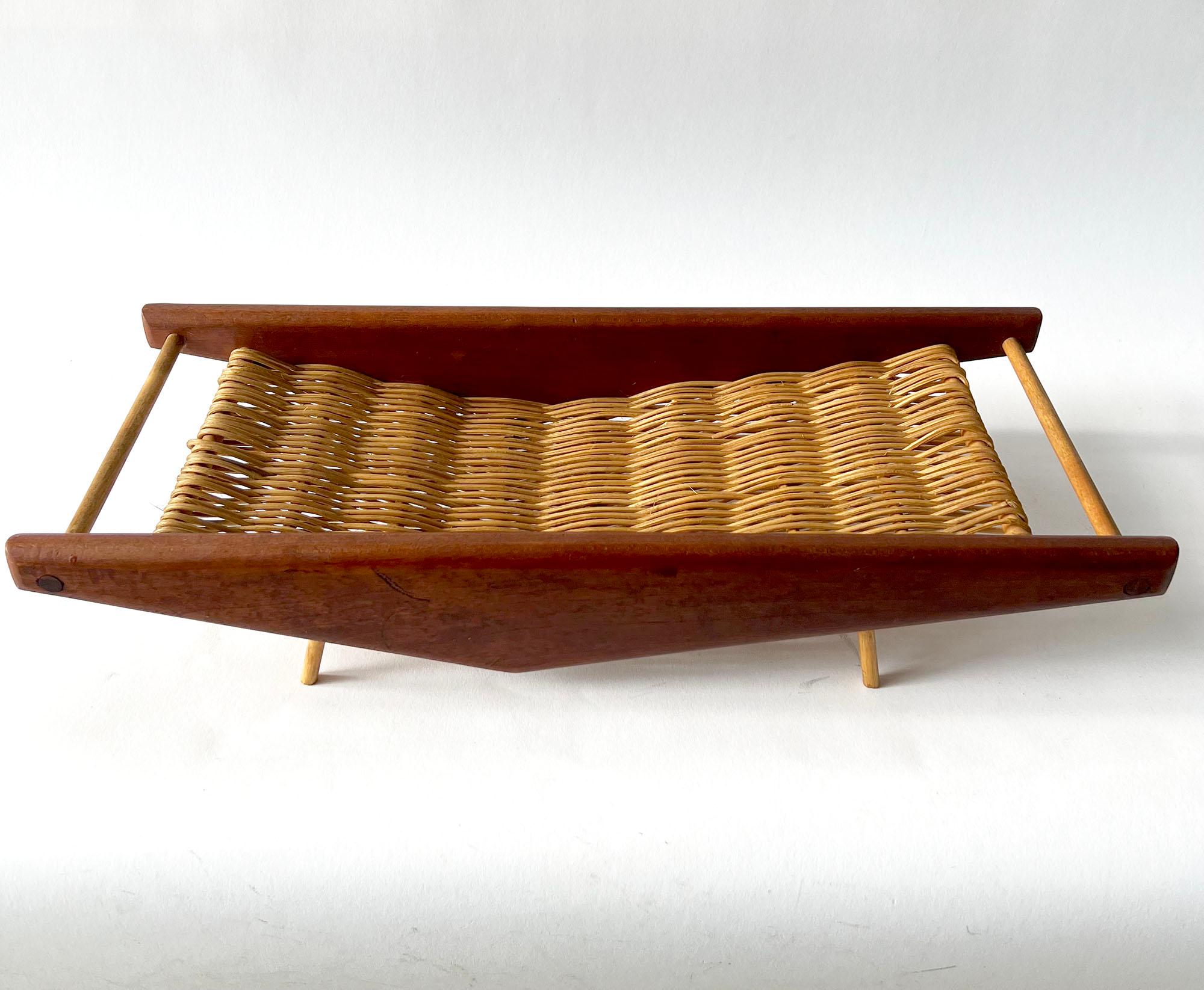 Hand woven rattan and teak wood basket, possibly designed and created by Arthur Umanoff. Piece could hold a few pieces of fruit, bread or stand alone due to its beautifully sculptured design. Basket measures 3.75