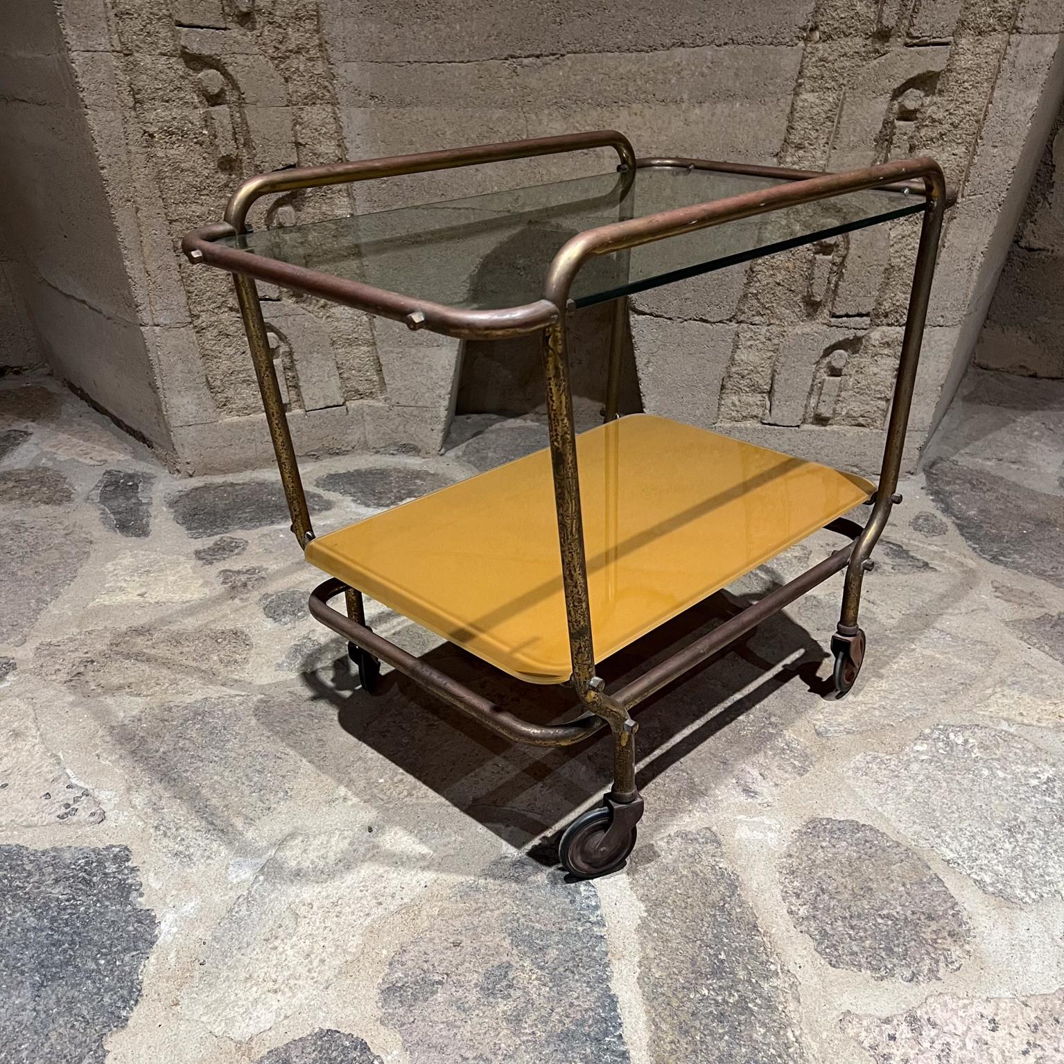 1950s Mexico lovely vintage Modern Brass Service Cart by Arturo Pani.
Body construction tubular brass. Original vintage wheels.
Cart comes with new glass top.
Vintage preowned condition unrestored brass has original vintage patina.
23 h x 26.5 w x