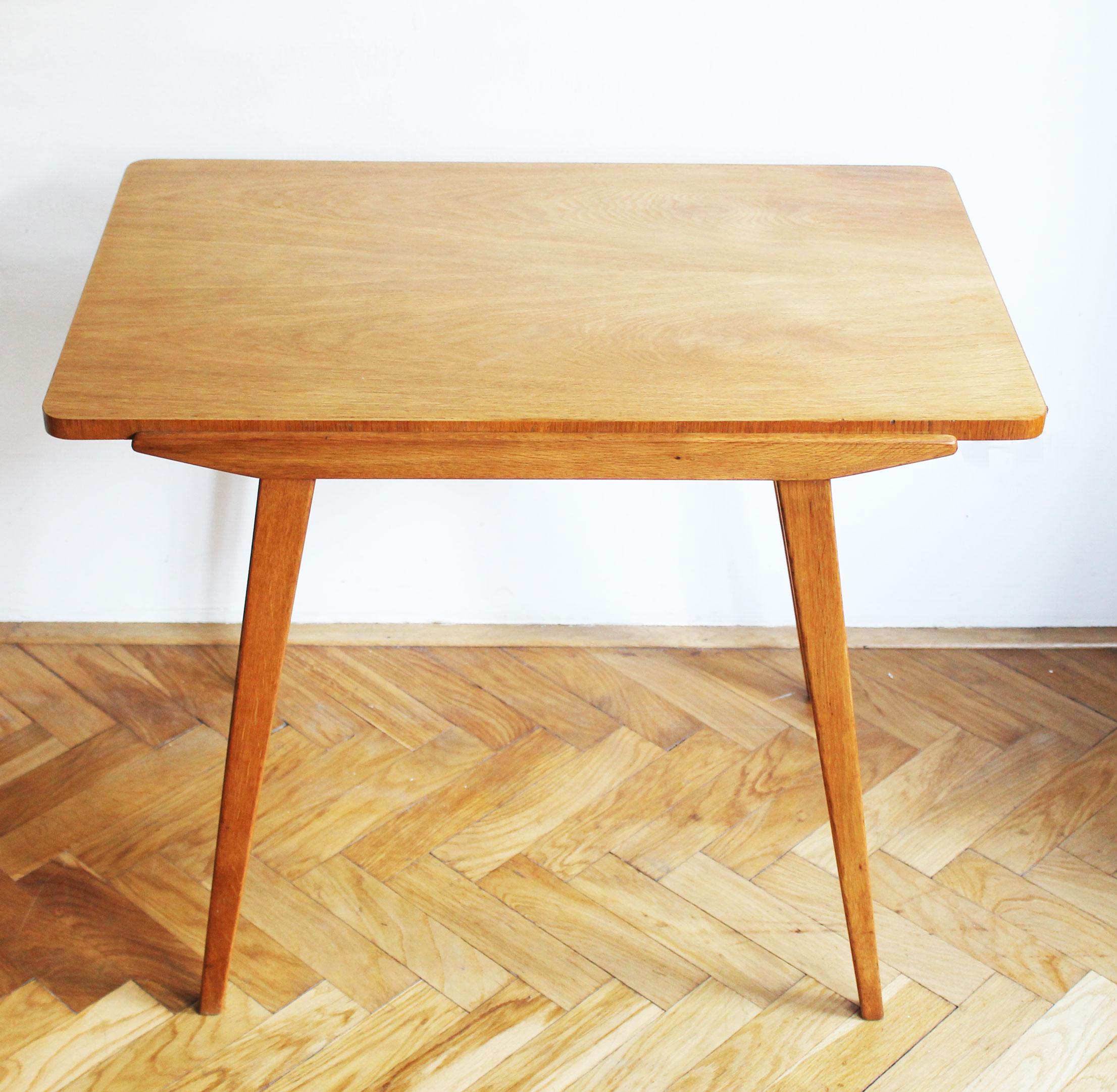 This Mid Century Modern coffee table is made of solid Ash, and has a beautiful grain and elegant tapering table legs. The table was produced by UP Zavody in the 1950’s. Sadly its designer is unknown but the table is very similar to the work of a