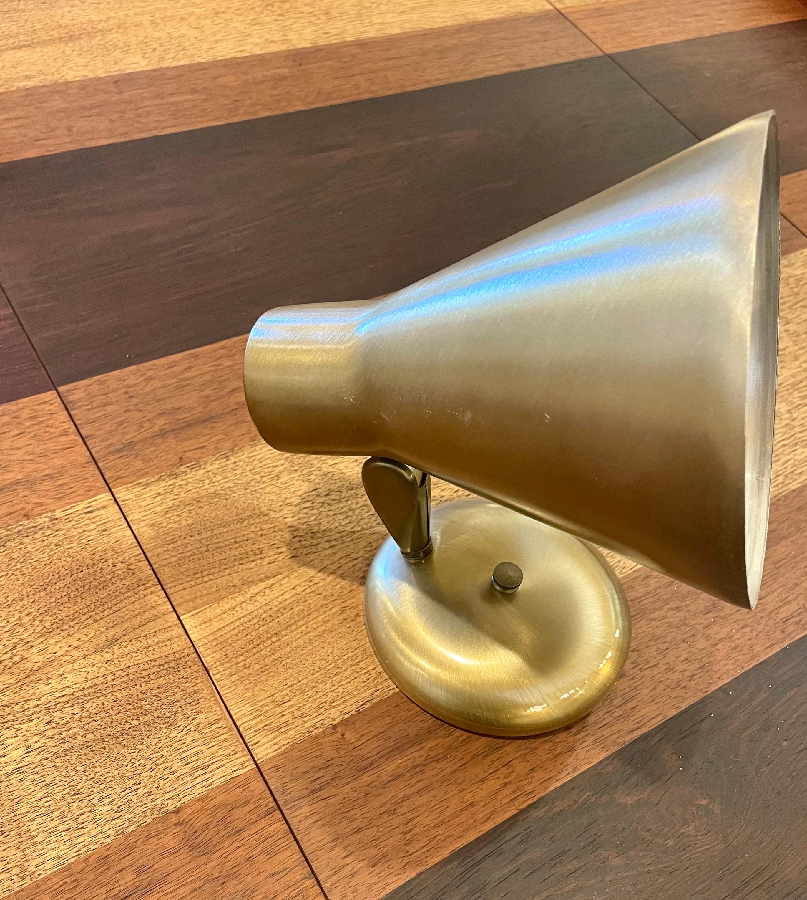 A hard to find single 1950s wall sconce, in brushed aluminum brass finish, swivel switch these pair looks like very light used the condition it's great the wiring its like new with ceramic switch, perfect working condition multidirectional position