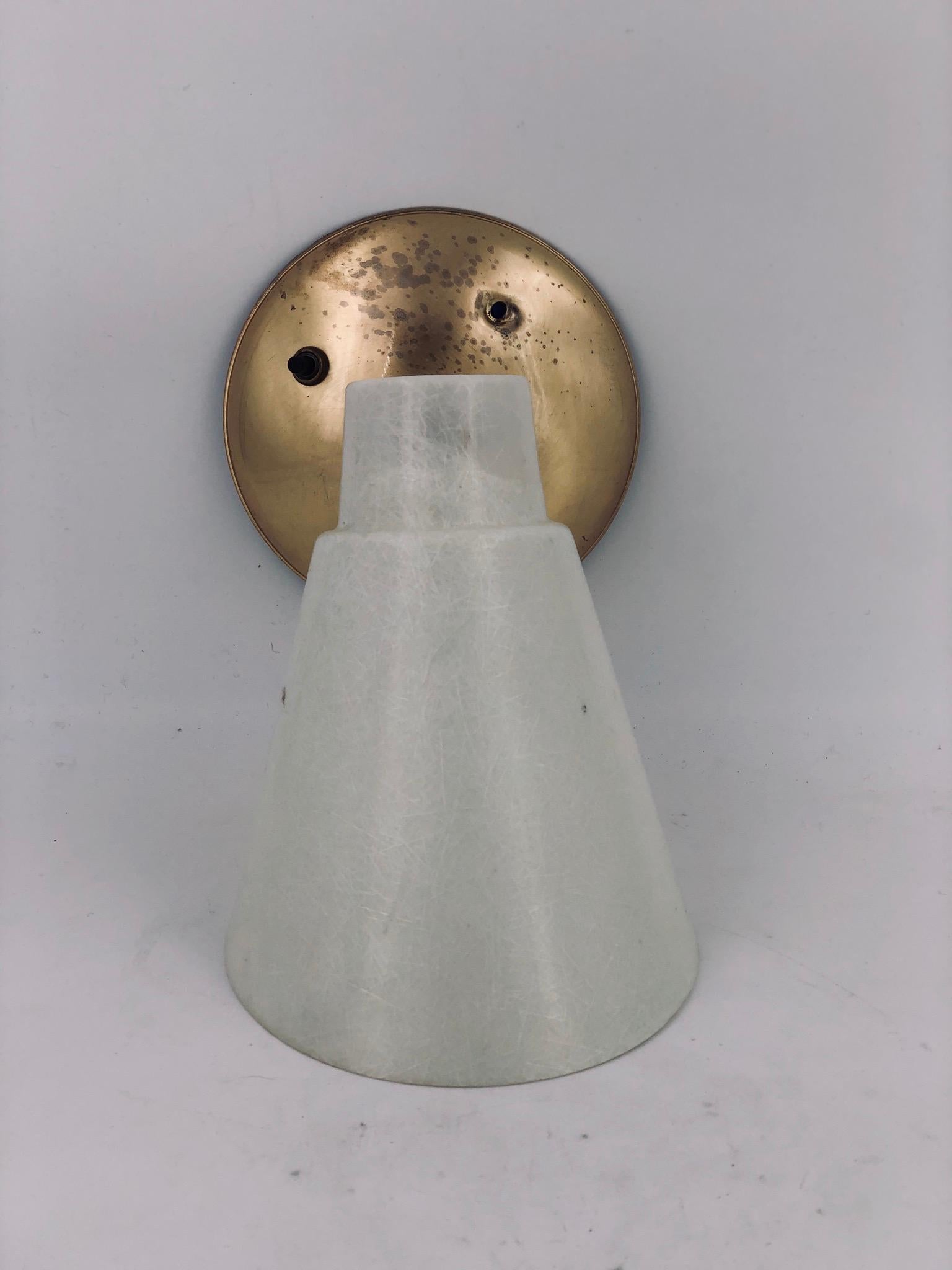 A hard to find and rare pair of 1950s wall sconces, with fiberglass shades and brass base, swivel switch these pair looks like was never used the condition it's great the wiring its like new with ceramic switch, perfect working condition