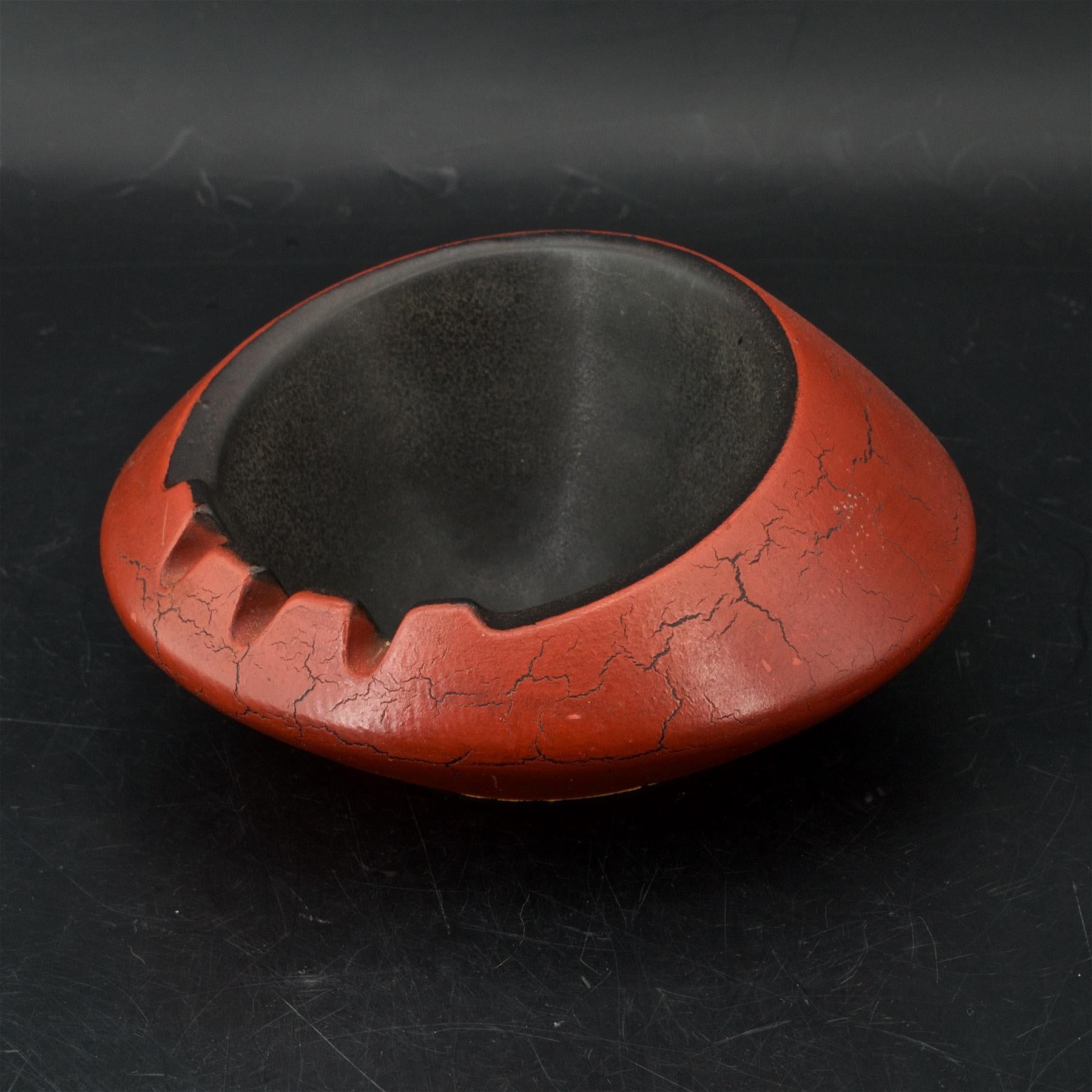 6 and a half inch round dish ashtray with cork bottom, and makers markings.