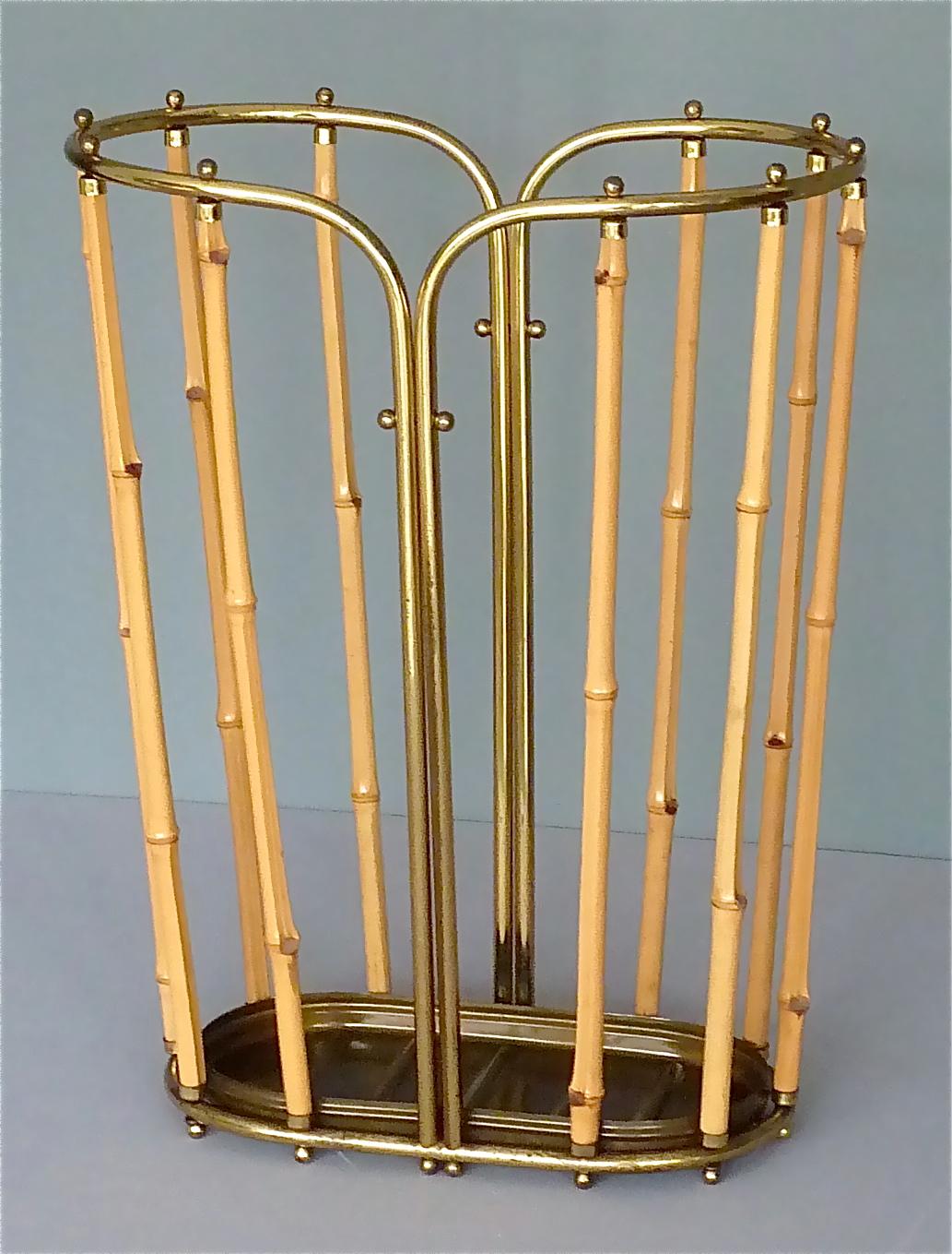 Exceptional 1950s Austrian modernist umbrella stand, which probably belongs to one of the wonderful designs by Aubock, Hagenauer, Josef Frank for Haus & Garten or Kalmar. It is made of bamboo and tubular brass with lovely small ball screw nuts. The