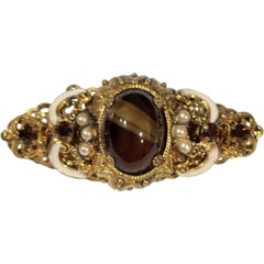 1950s Austro-Hungarian Revival Gilded Filigree Brooch with Tiger’s Eye Glass