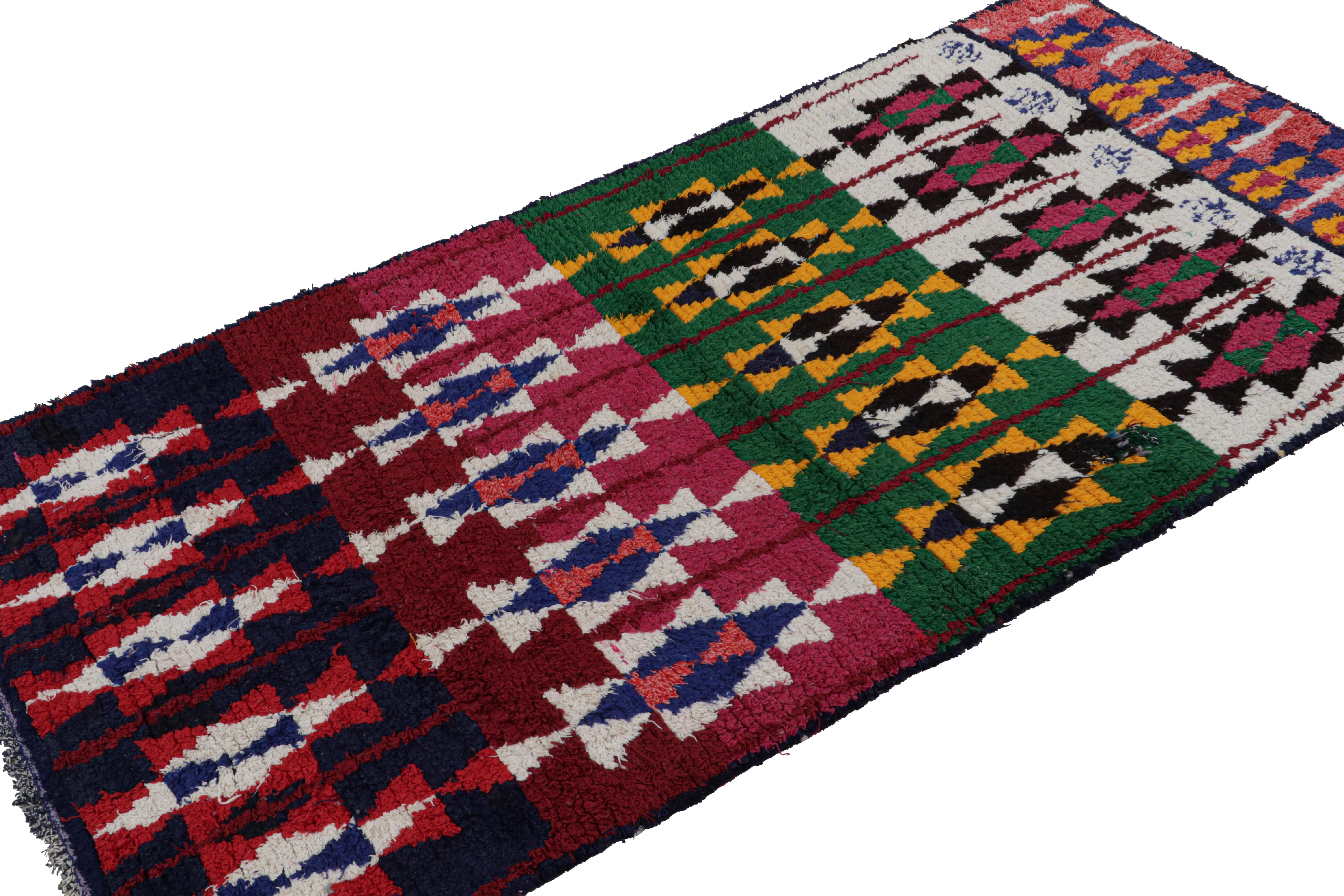 Hand-knotted in wool and fabric circa 1950-1960, this vintage 4x8 Moroccan Boucherouite rug is believed to hail from the Azilal tribe. 

On the Design: 

This rug enjoys a whimsical play of red, blue, pink, green and gold in the geometric patterns.
