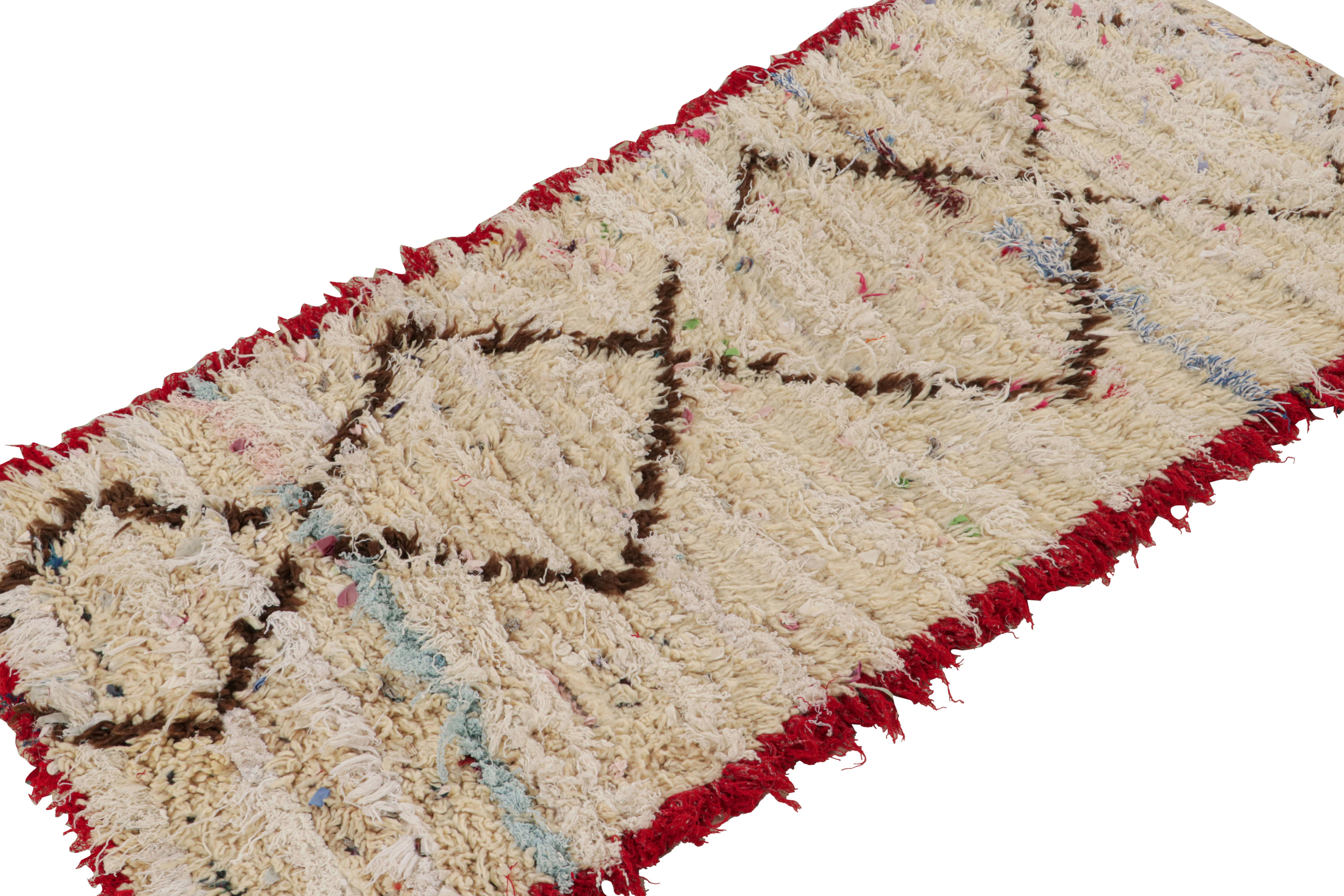 Hand-knotted in wool and cotton circa 1950-1960, this vintage 3x5 Moroccan rug is believed to hail from the Azilal tribe. 

On the Design: 

This rug enjoys a repetition of brown diamond patterns on a beige background. This simple design gets an