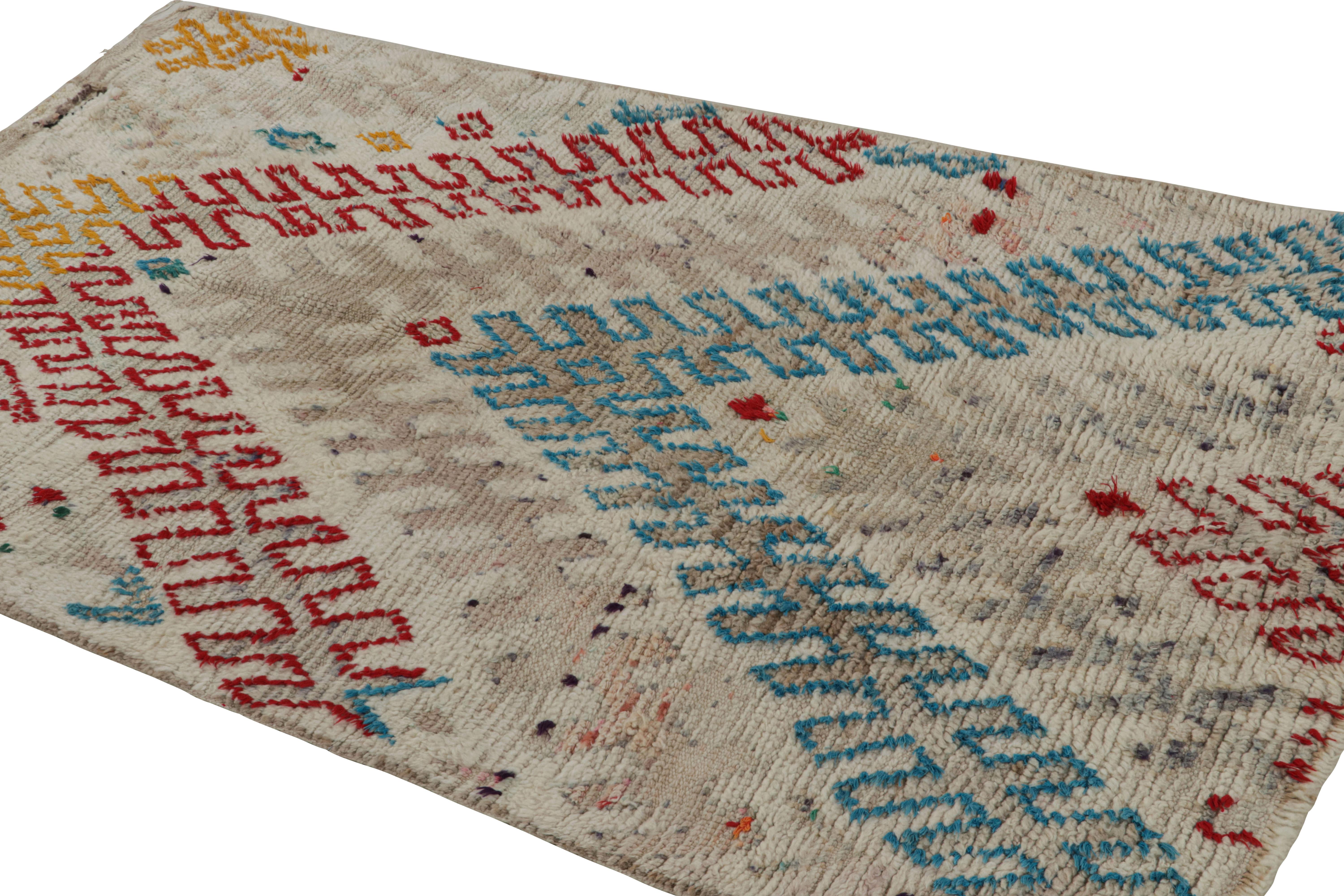 Hand-knotted in wool circa 1950-1960, this vintage 4x7 Moroccan rug is believed to hail from the Azilal tribe. 

On the Design: 

This rug enjoys polychromatic patterns on a comfortable white background. Keen eyes will further admire its healthy