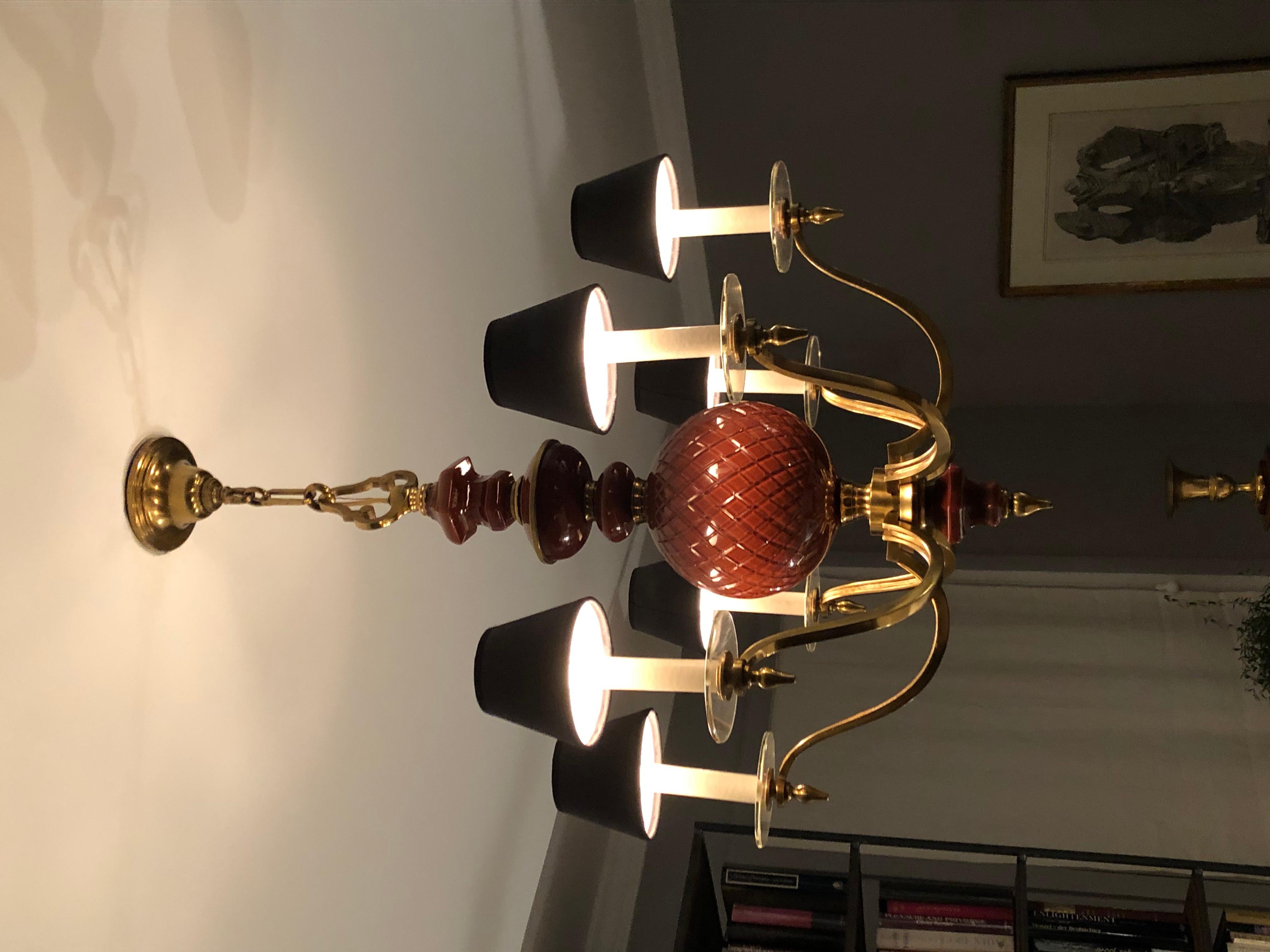 Our chandelier can be identified as Baguès, circa 1950, based on a similar model published in the magazine Plasir de France that very year. Stylistically, it represents what Baguès was, and remains, best known for, namely, modern interpretations of