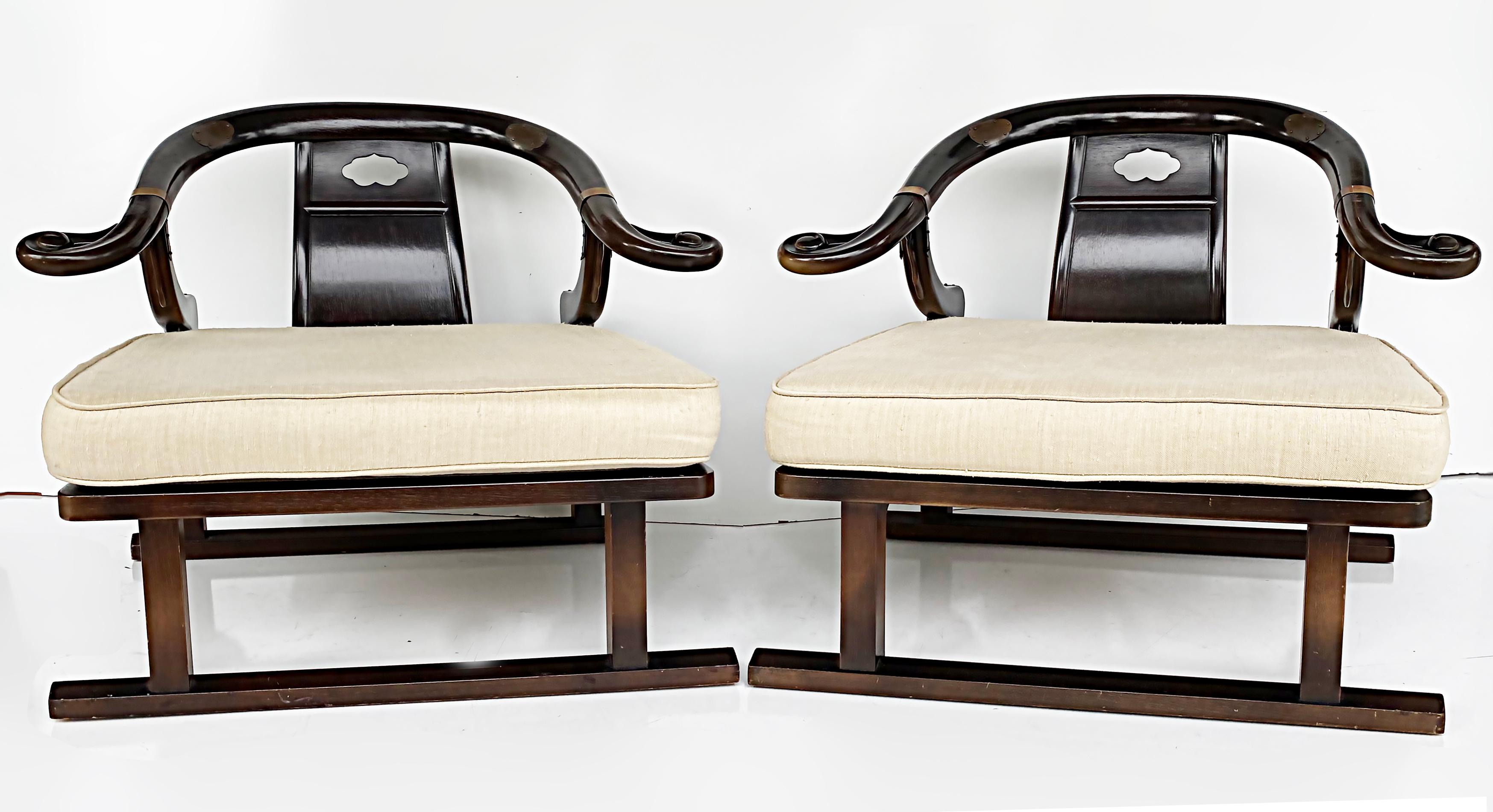 1950s Baker Michael Taylor Far East Collection Club chairs, Raw Silk Cushions

Offered for sale is a pair of Baker Furniture armchairs from the Far East collection designed by Michael Taylor in the 1950s. These Asian inspired horseshoe style