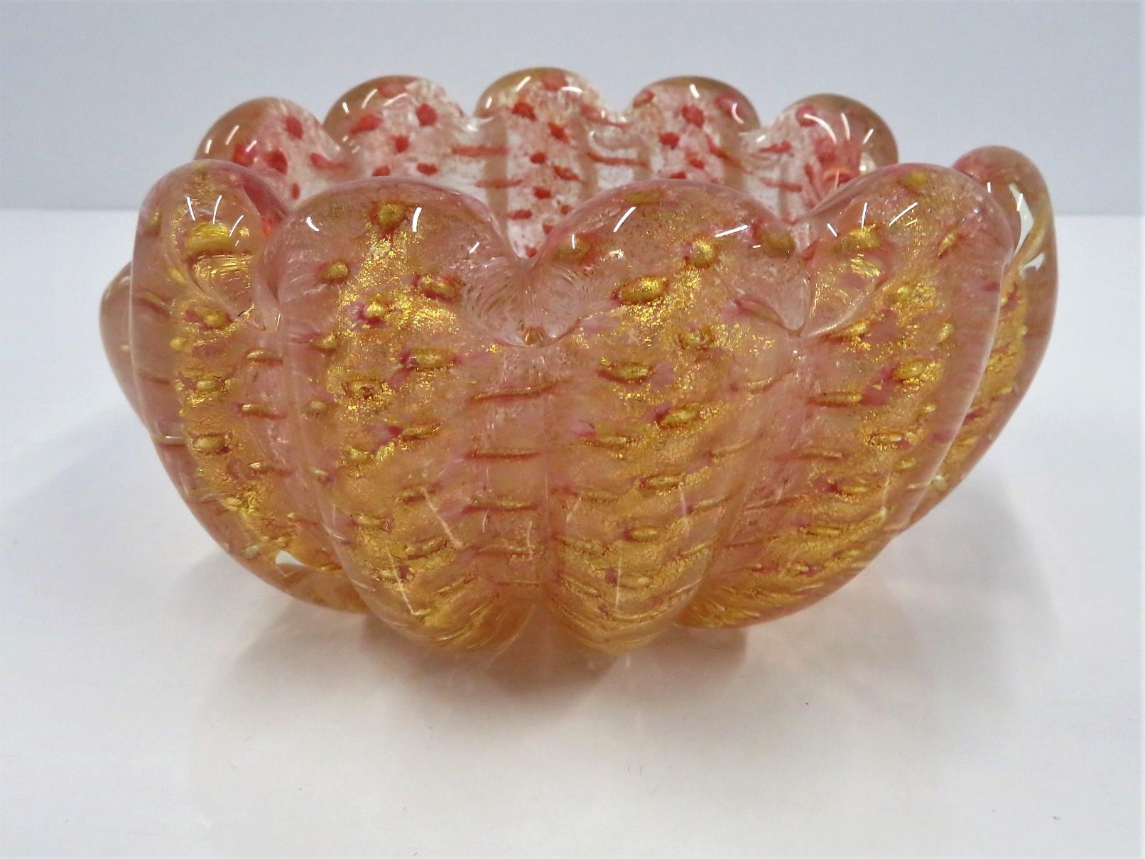 Exquisite 1950s bubbly creation in blown glass by Barovier Toso. Most likely by Ercole Barovier, it is a lobed vessel with pink and gold infusions called Coronato d'Oro Bullicante. A rich Murano masterpiece.
Measurements:  6 inches deep x 6 7/8