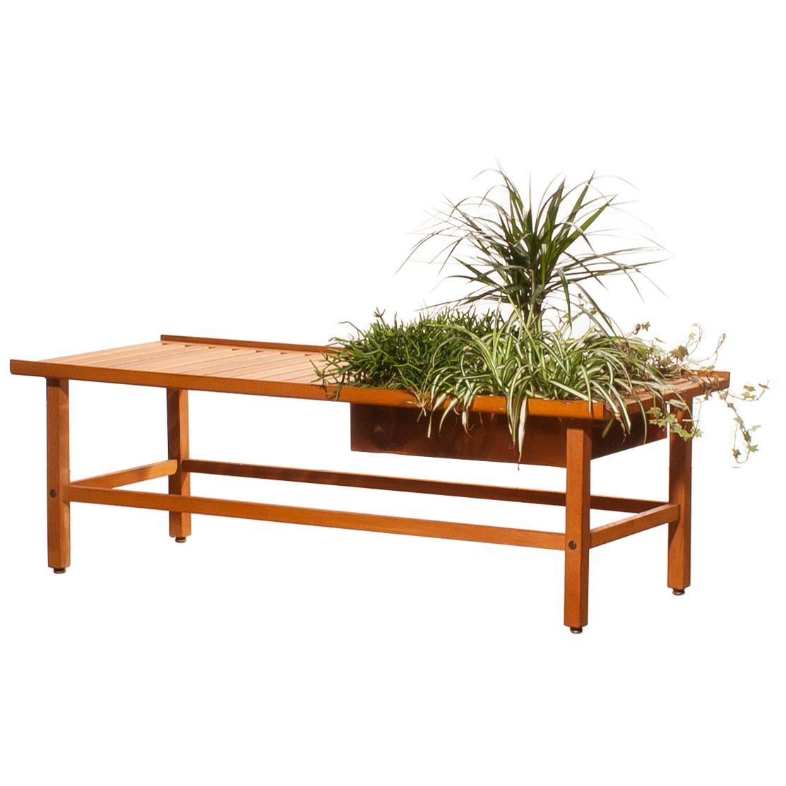 A beautiful plant bench designed by Yngve Ekström.
The bench is made of teak.
There is room for plants of flowers in the copper compartment.
It is in excellent condition.
Period 1950s.
Dimensions: H 39 cm, D 48 cm, W 120 cm.