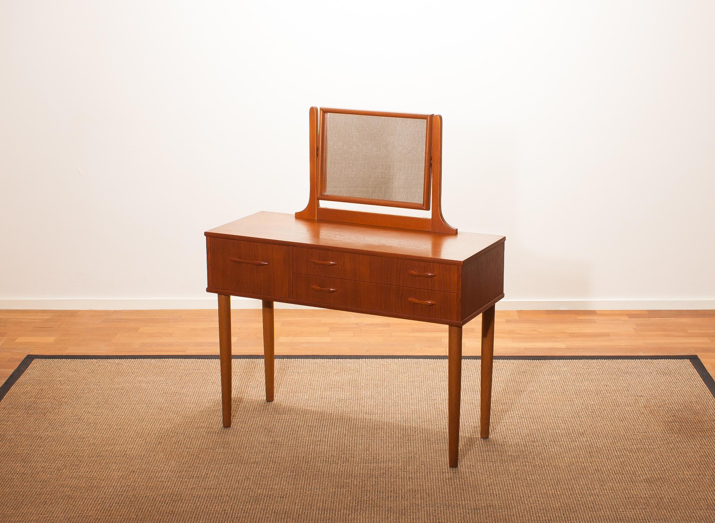 Beautiful dressing table by Ulferts Sweden.
This dressing table is made of teak and consists of three drawers and a mirror.
It is in wonderful condition.
Period 1950s
Dimensions: H. 111 cm (including mirror, the height of the table top 72