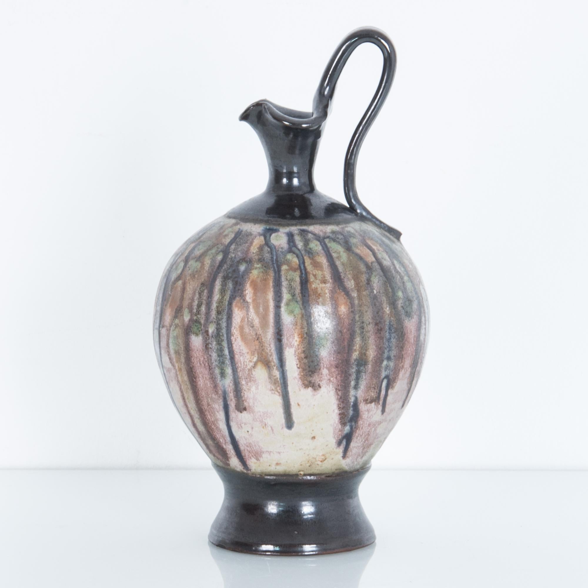 Ceramic stoneware pitcher from Belgium, circa 1950s. These distinctive ceramics pieces were produced in mid-20th century Belgium in the Bouffioulx region. Featuring distinctive graphic textured glazes on simple forms this local style was produced by