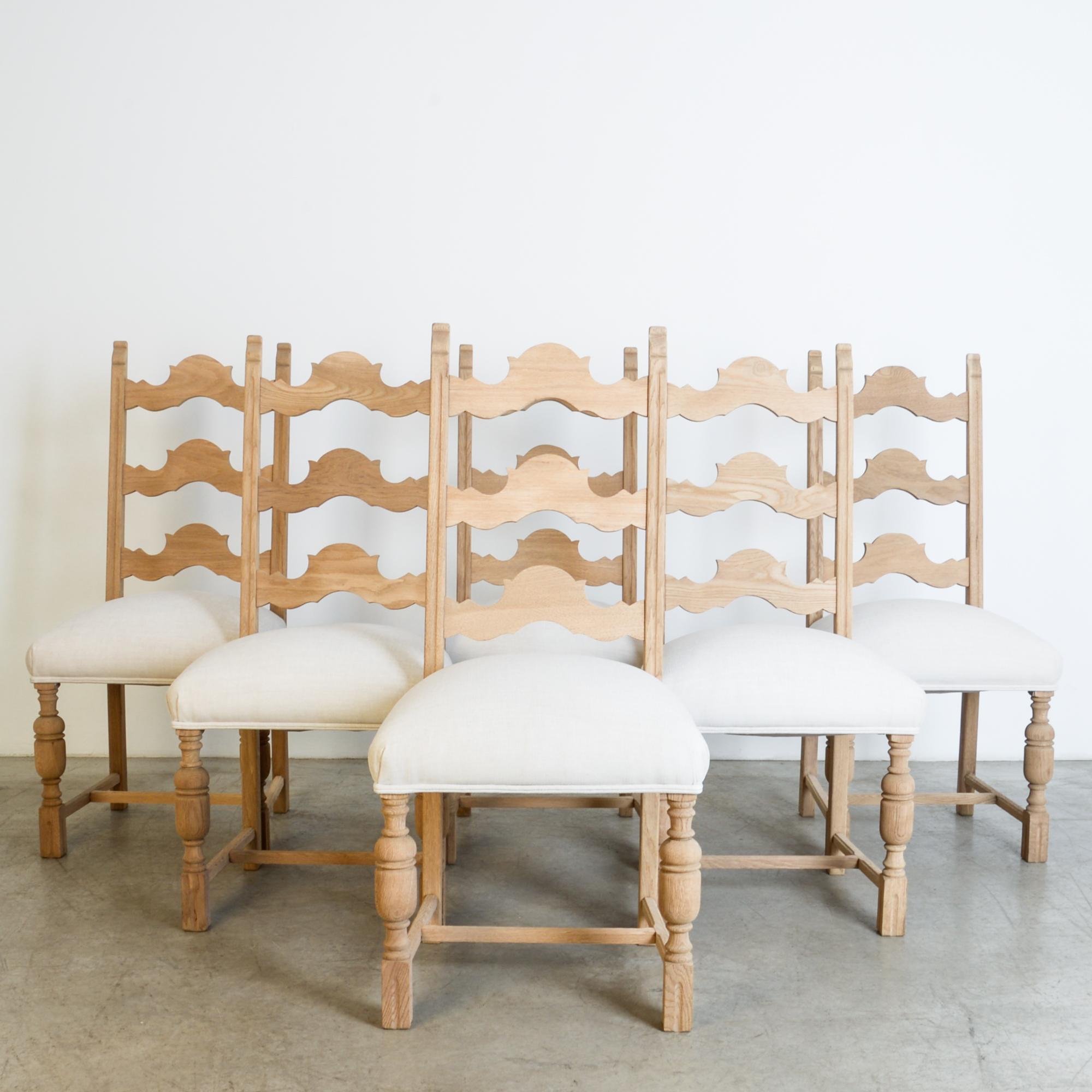 A 1950s fashion, traditional furniture forms are simplified, updated through a contemporary lens. High quality oak construction maintains the essential vocabulary of French style with scalloped rails, turned front legs and carved ears, for an
