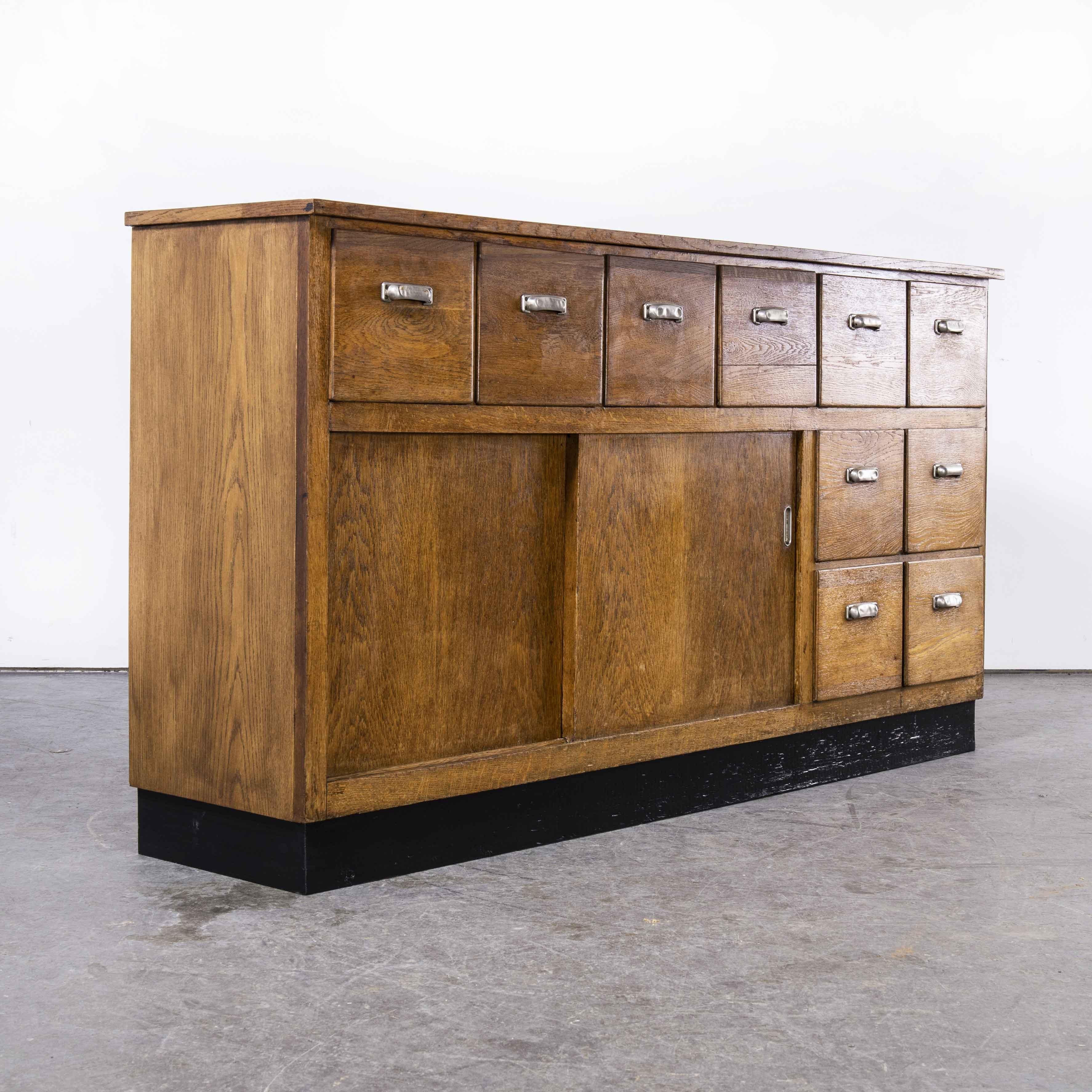 Mid-20th Century 1950's Belgian Oak Apothecary Cabinet with Ten Drawers