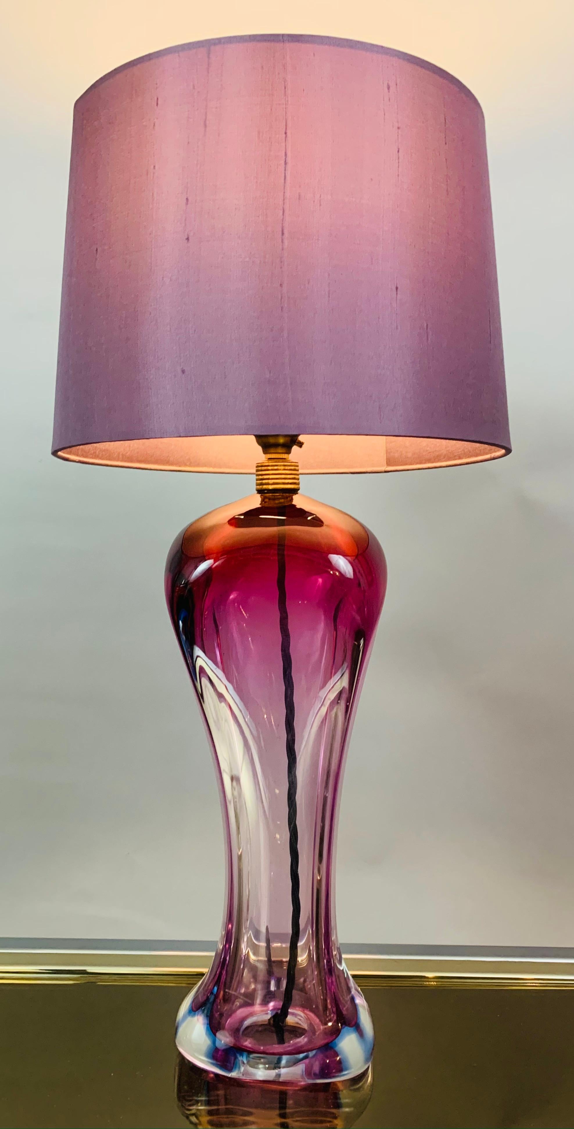 An unusual 1950s Belgium purple table lamp with a sommerso style violet line around the base encased with clear glass. In the style of Val Saint Lambert but no signature or foil label to identify it as such is present. A feature original antiqued