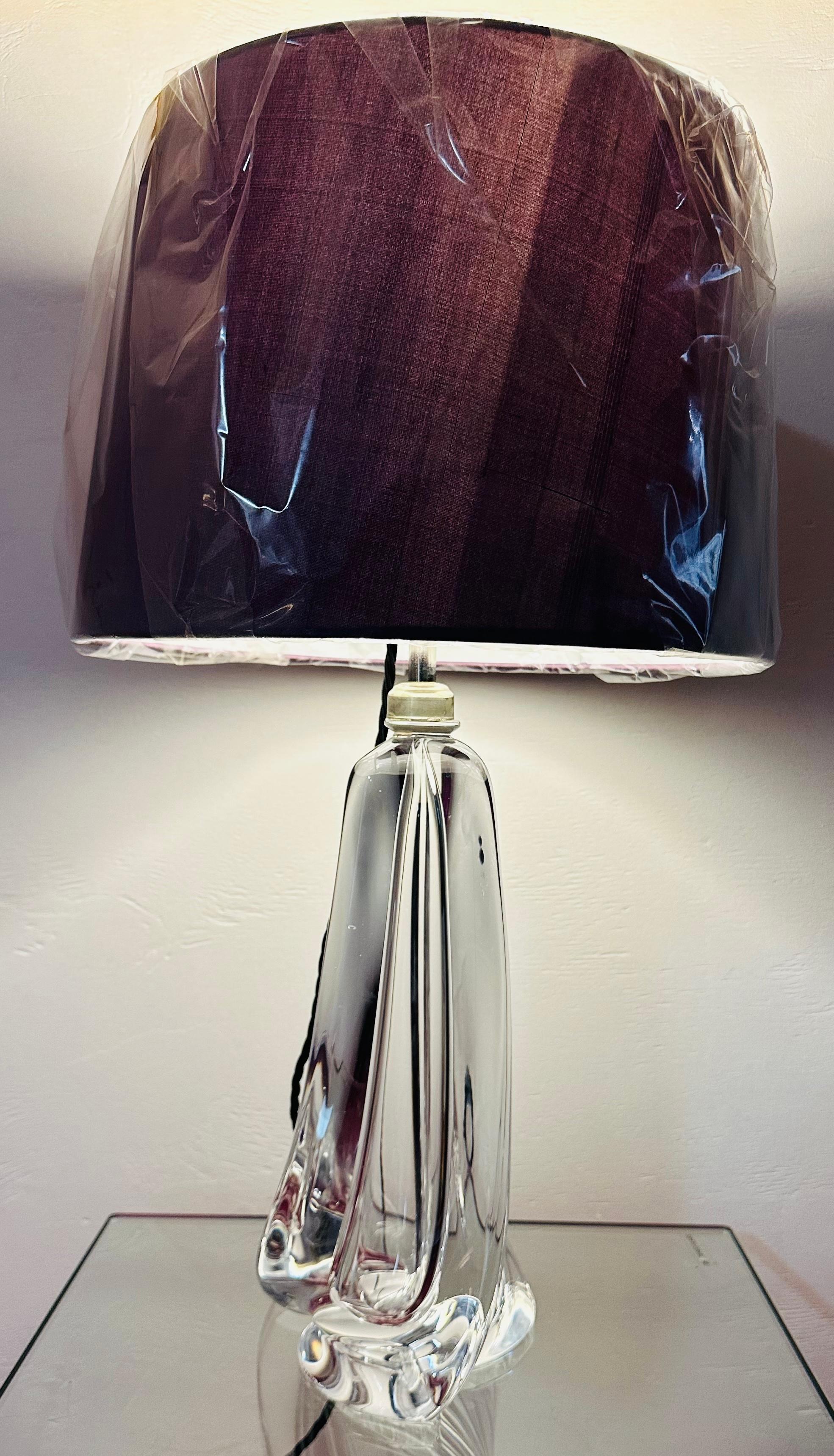 1950s Belgium Val Saint Lambert clear crystal glass table lamp base with a turned elegant tapering form. The lamp is fitted with a polished chrome mounted socket with the on/off switch fitted within it which can be accessed from underneath the