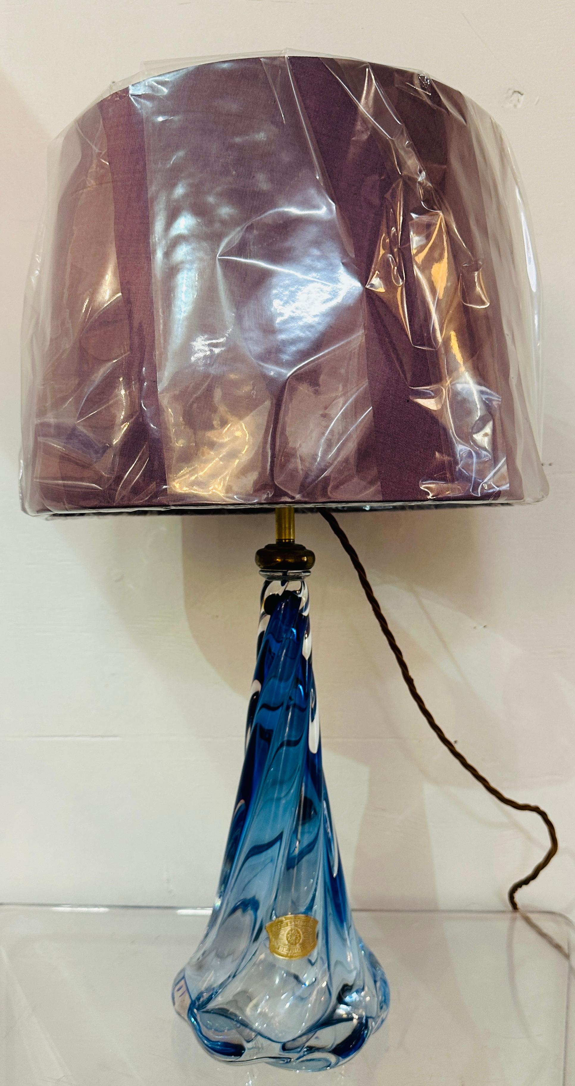 1950s Belgium Val Saint Lambert blue and clear crystal glass twisted lamp base. The lamp base fades from a deep blue encased in clear glass at the top to become clearer fading towards the base. The lamp base has a beautiful flowing swirled delicate
