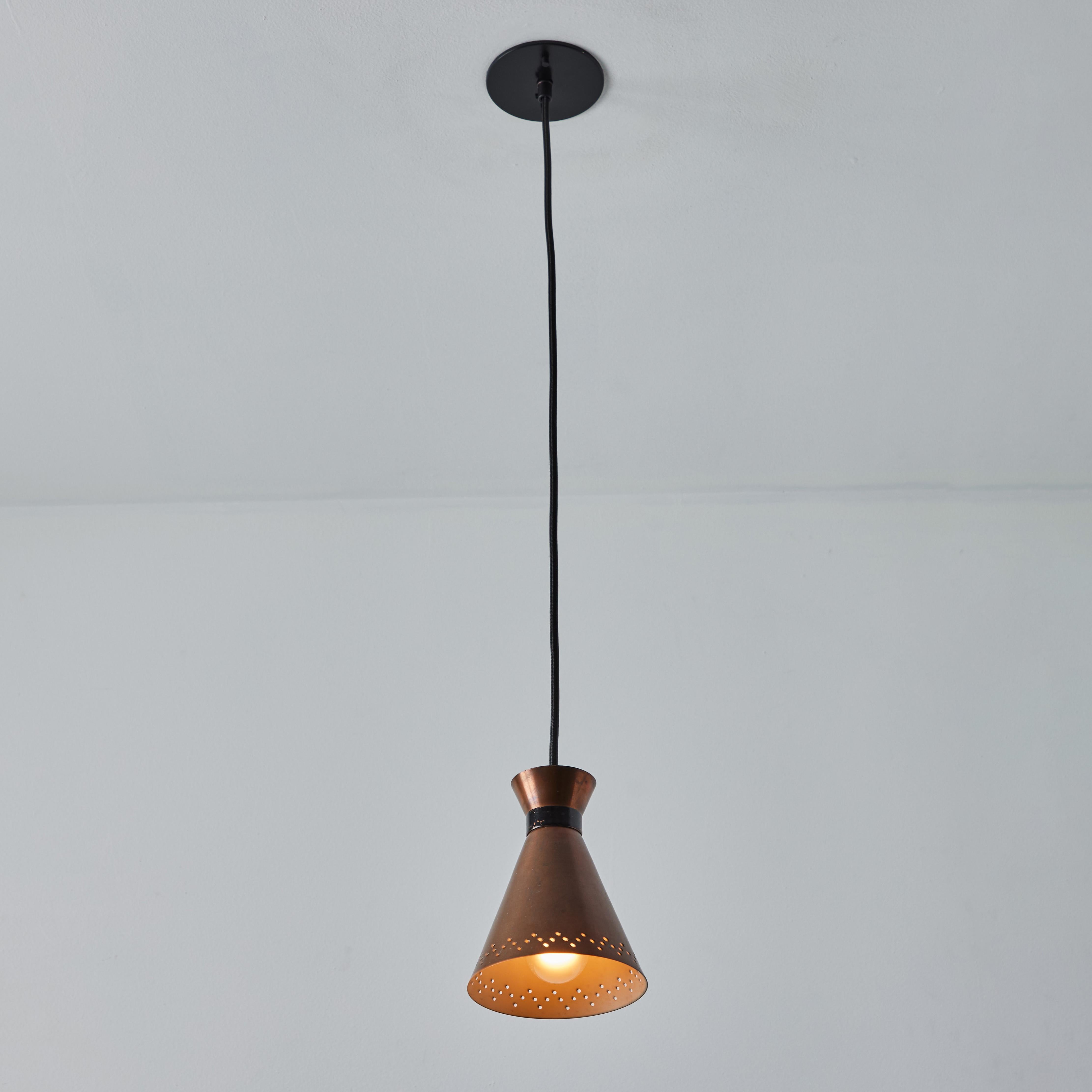 Scandinavian Modern 1950s Bent Karlby Perforated Diabolo Pendant in Copper for Lyfa For Sale