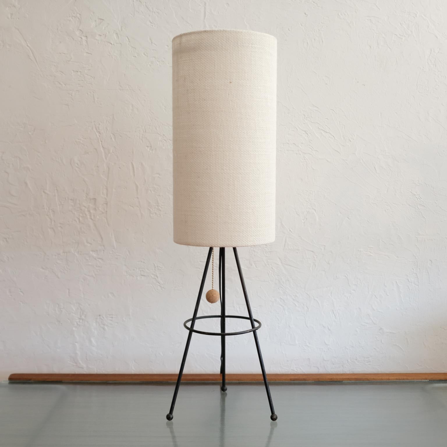 Early 1950s table lamp designed by Bill Lam for his company, Lam Workshop. A simple modern form constructed of solid iron rods. Original paint and new shade. The floor version of this lamp was specified for Case Study House 1950.

Bill Lam