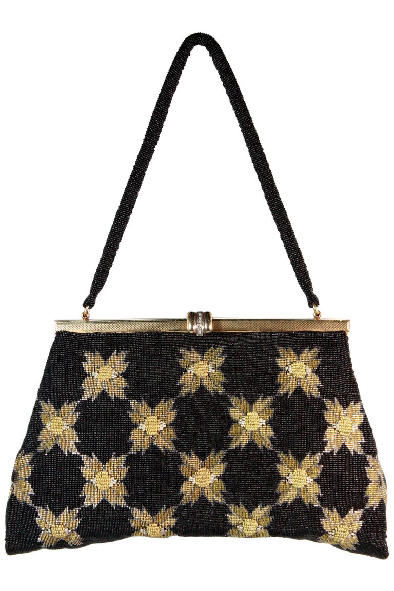 Black and gold caviar beaded evening purse 
Floral micro beaded design 
Gold jeweled clasp closure 
Black beaded strap
Black silk lining 
Silk inner pocket 
Unknown designer 