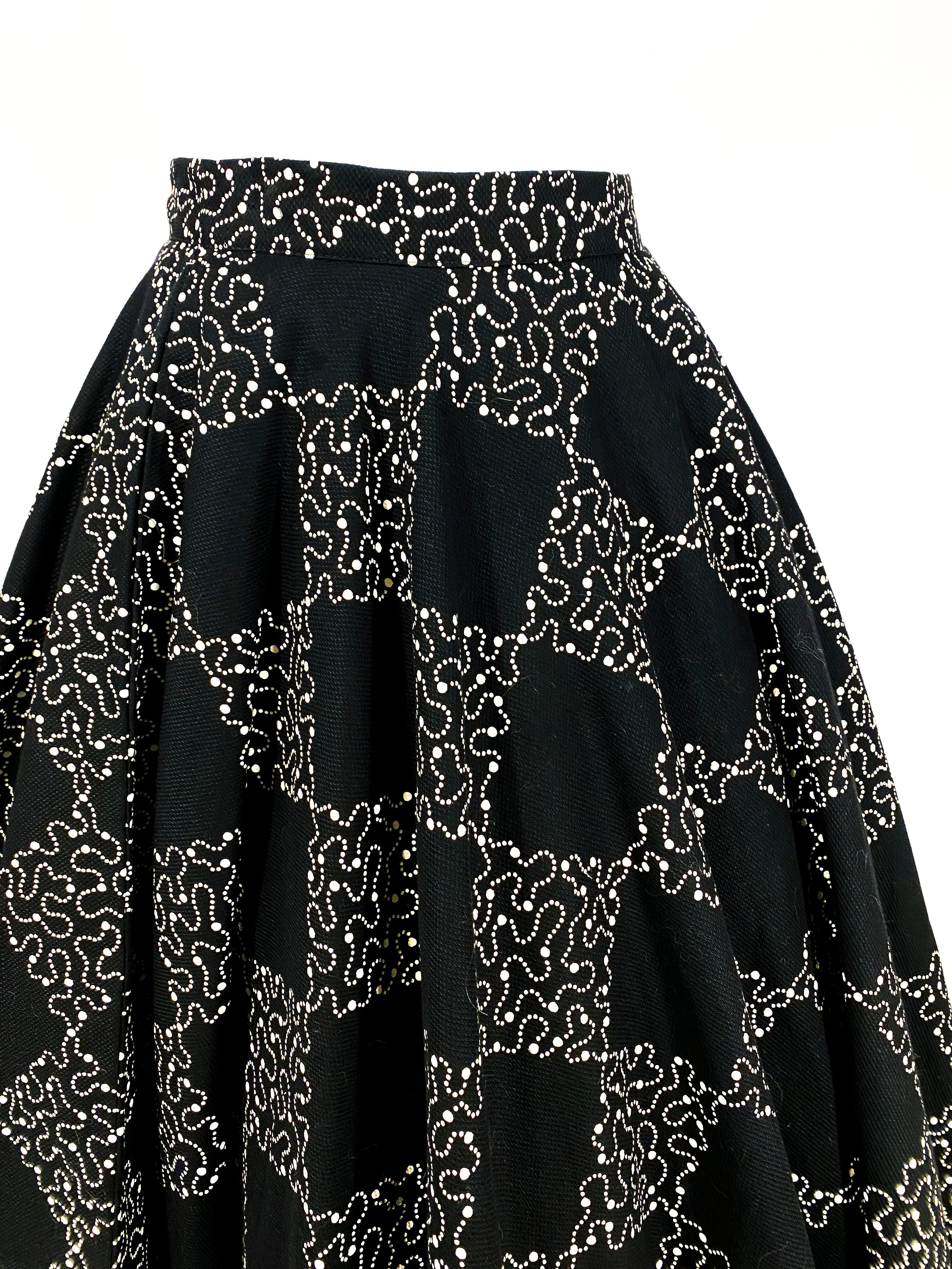 1950s black pique full circle skirt featuring a dotted line checkerboard print in a contrasting white. There is a side metal zipper closure on one side and a useable hidden pocket on the other side. This skirt is meant to be worn with a petticoat as