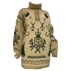 Maglione a collo alto in lana lavorato a intarsio con motivo folcloristico, anni '50, nero e crema