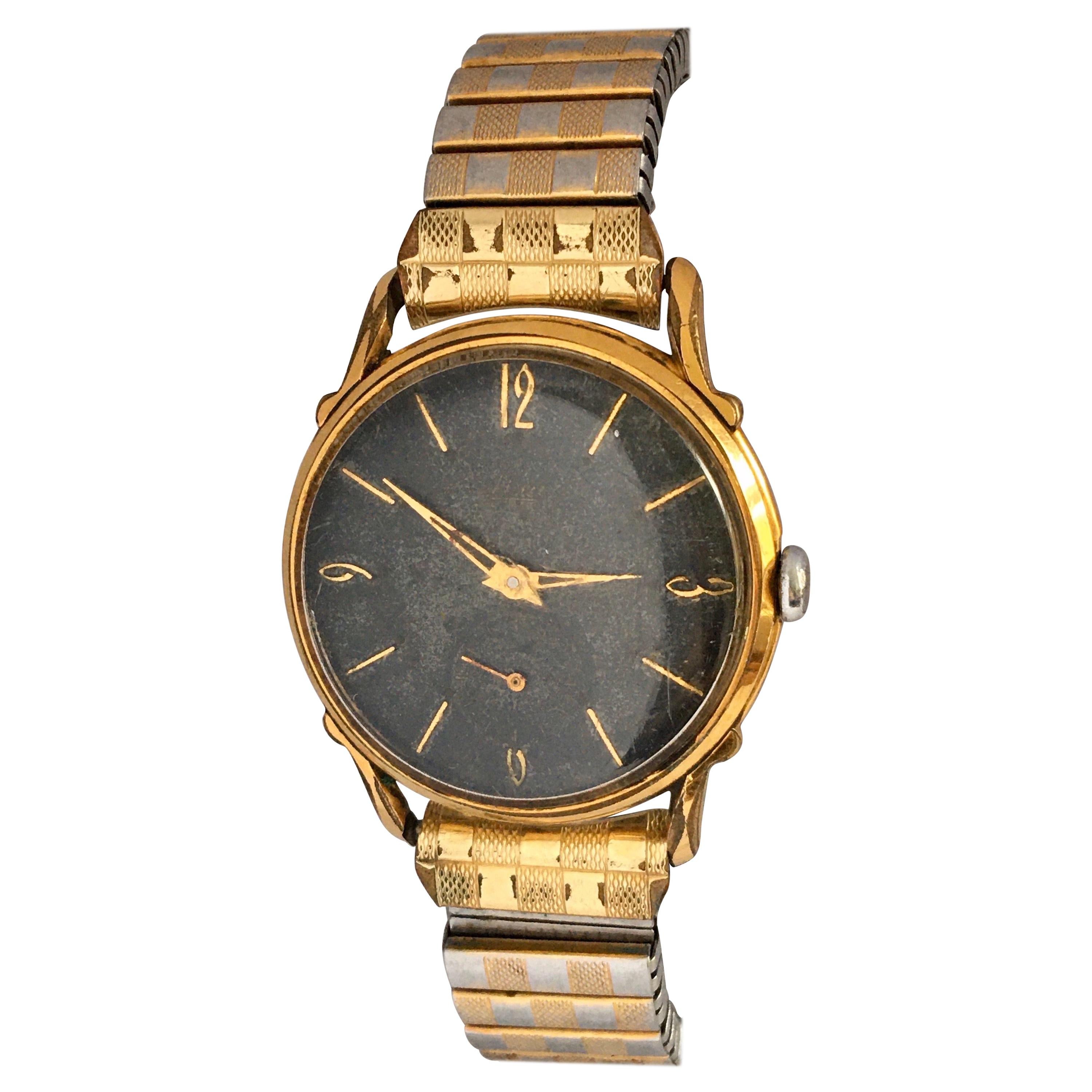 1950s Black Dial Gold-Plated and Stainless Steel Back Swiss Mechanical Watch For Sale