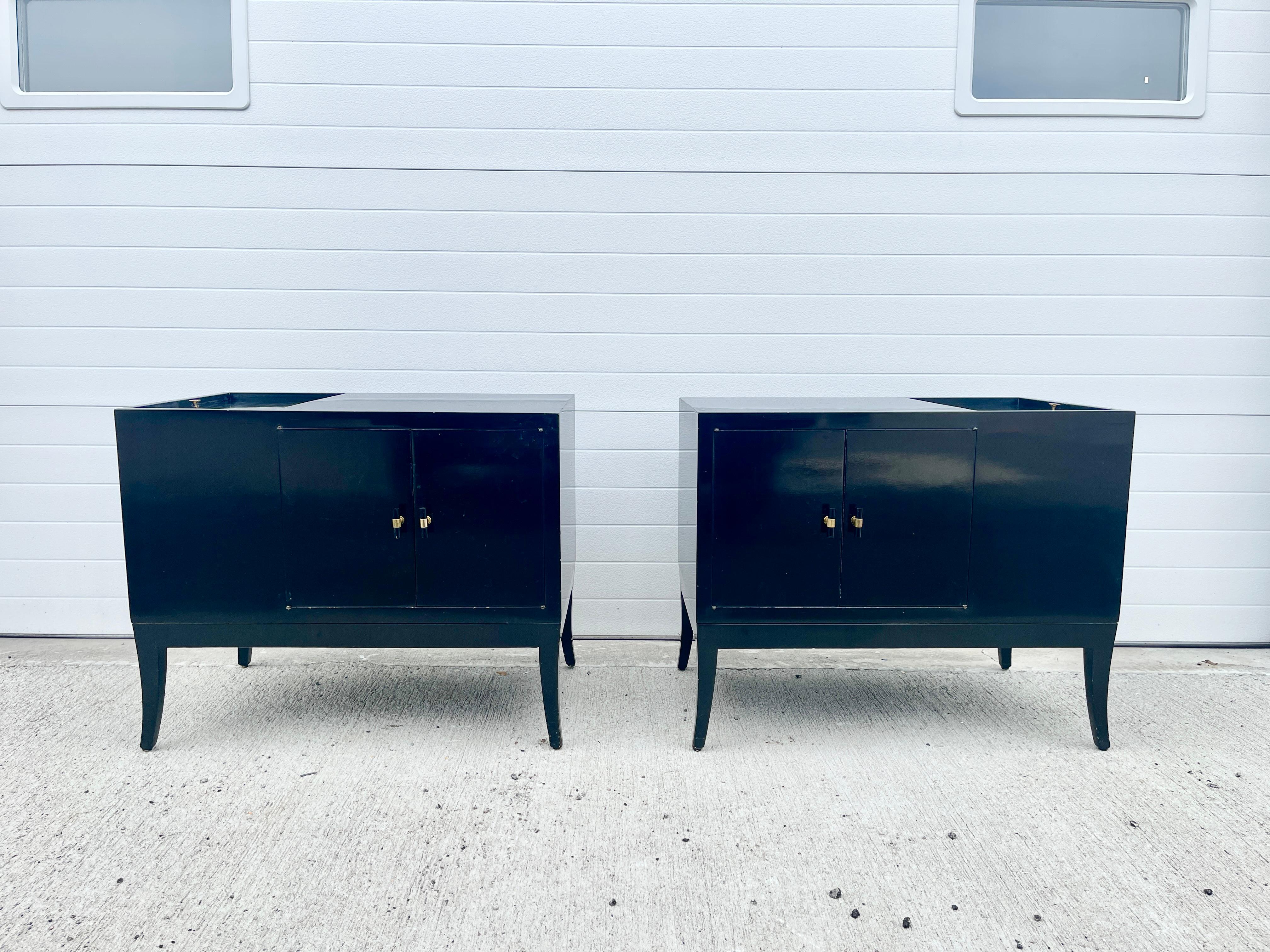 Pair of black lacquered bedside cabinets with slots for LP record album storage.
Sliding door on top reveals compartment with slots for albums (or your books and magazines); front double doors open to cabinet space with a single removable shelf.
