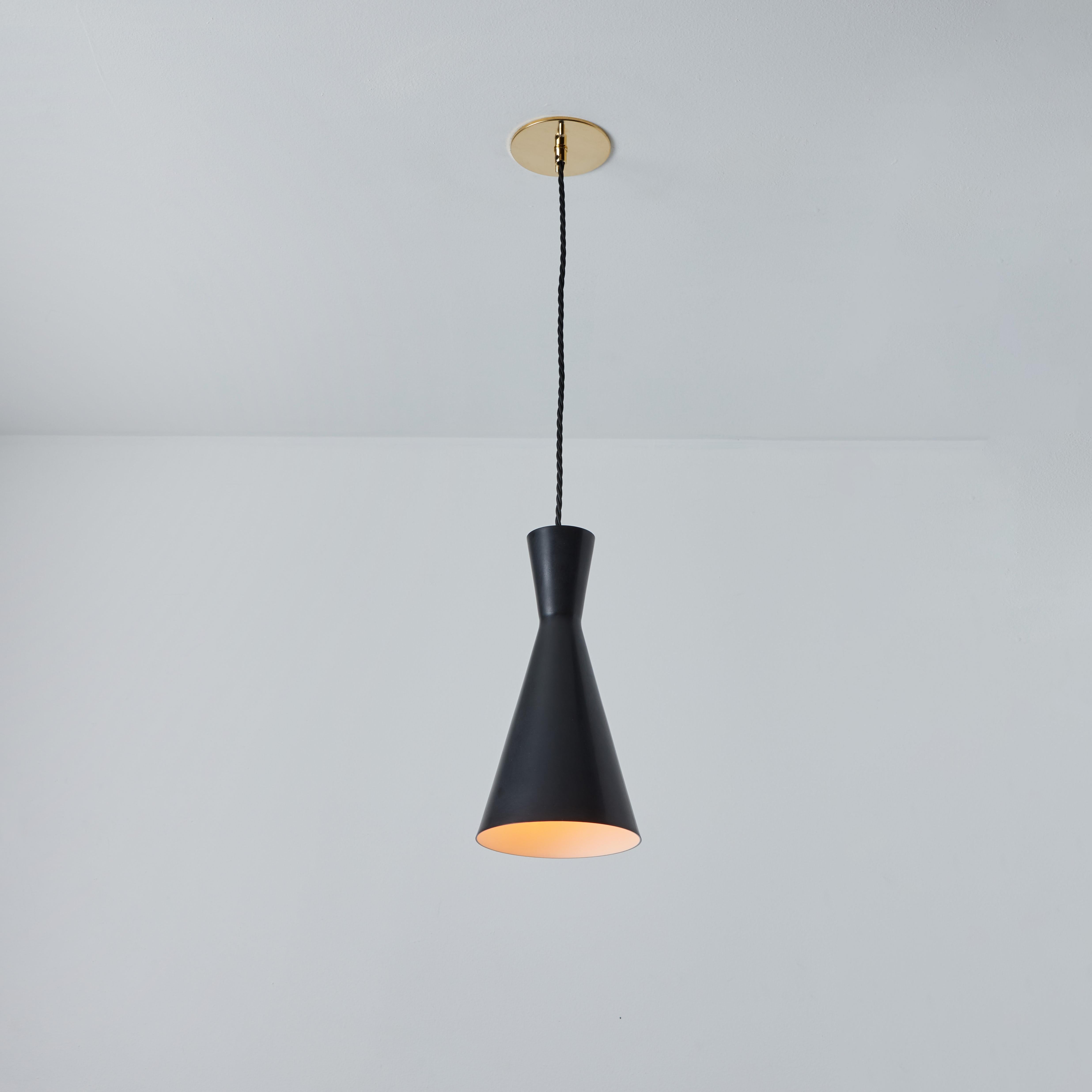 1950s Black metal Diabolo pendant lamp attributed to Stilnovo. Executed in black painted metal with new black cloth cord and custom fabricated period style brass canopy for mounting over a standard American j-box. An incredibly refined and clean