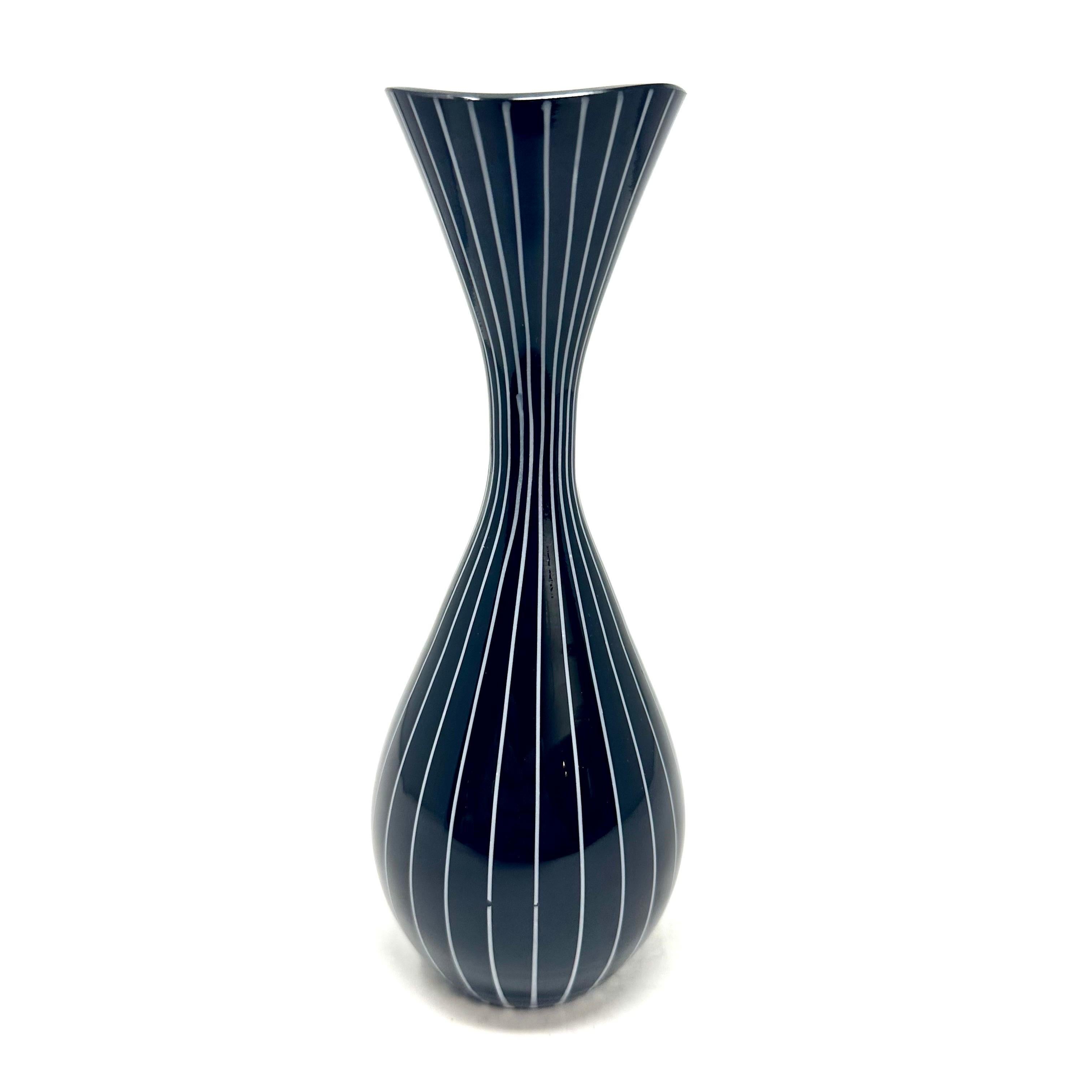 1950s black striped cased glass vase designed by Gunnar Ander for Lindshammer. Made in Sweden, the vase has a black and white striped exterior and white interior. In excellent condition.

Diameter: 2.75 in / Height: 7.125 in
