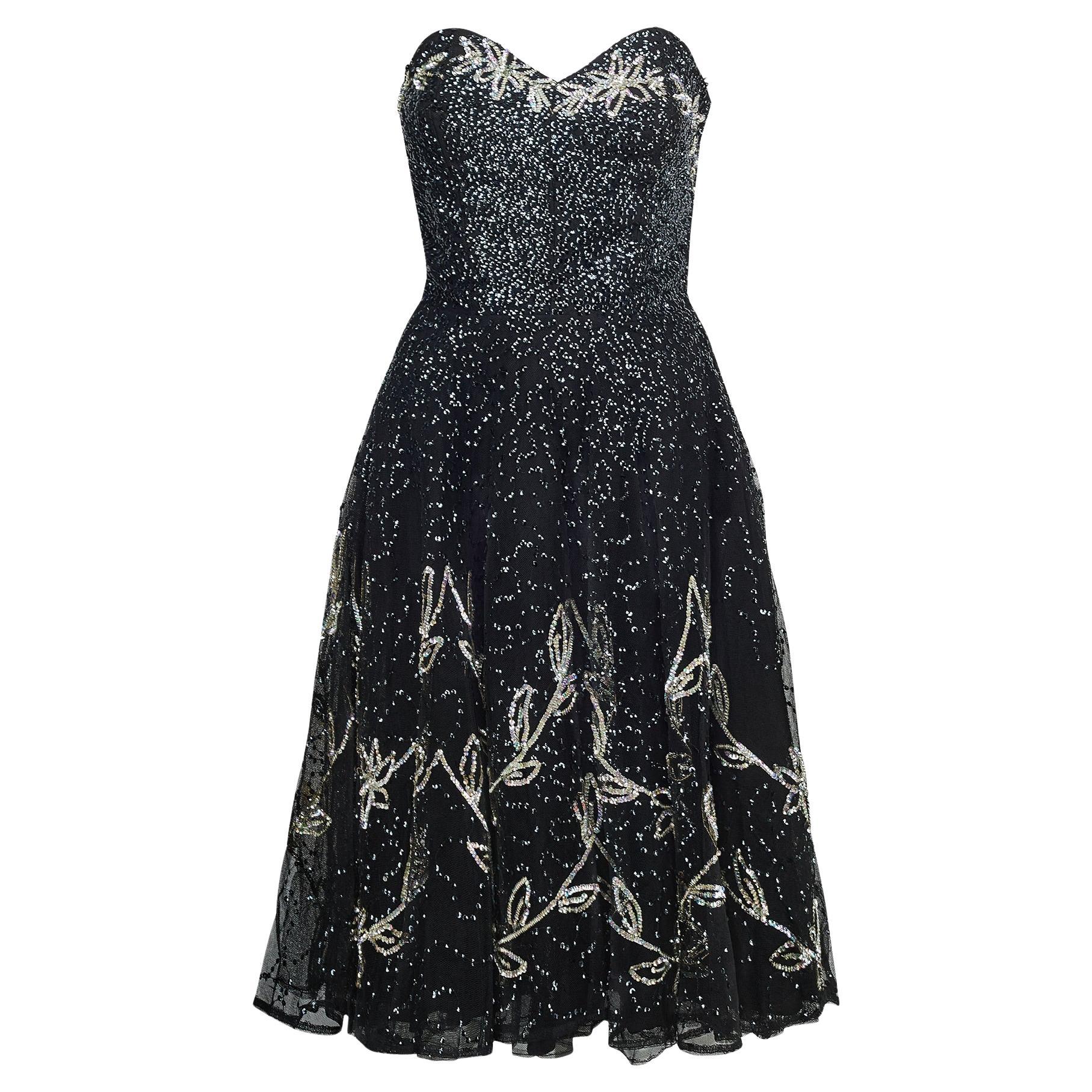 Abito anni
50 in tulle nero e paillettes senza spalline con disegni floreali in argento