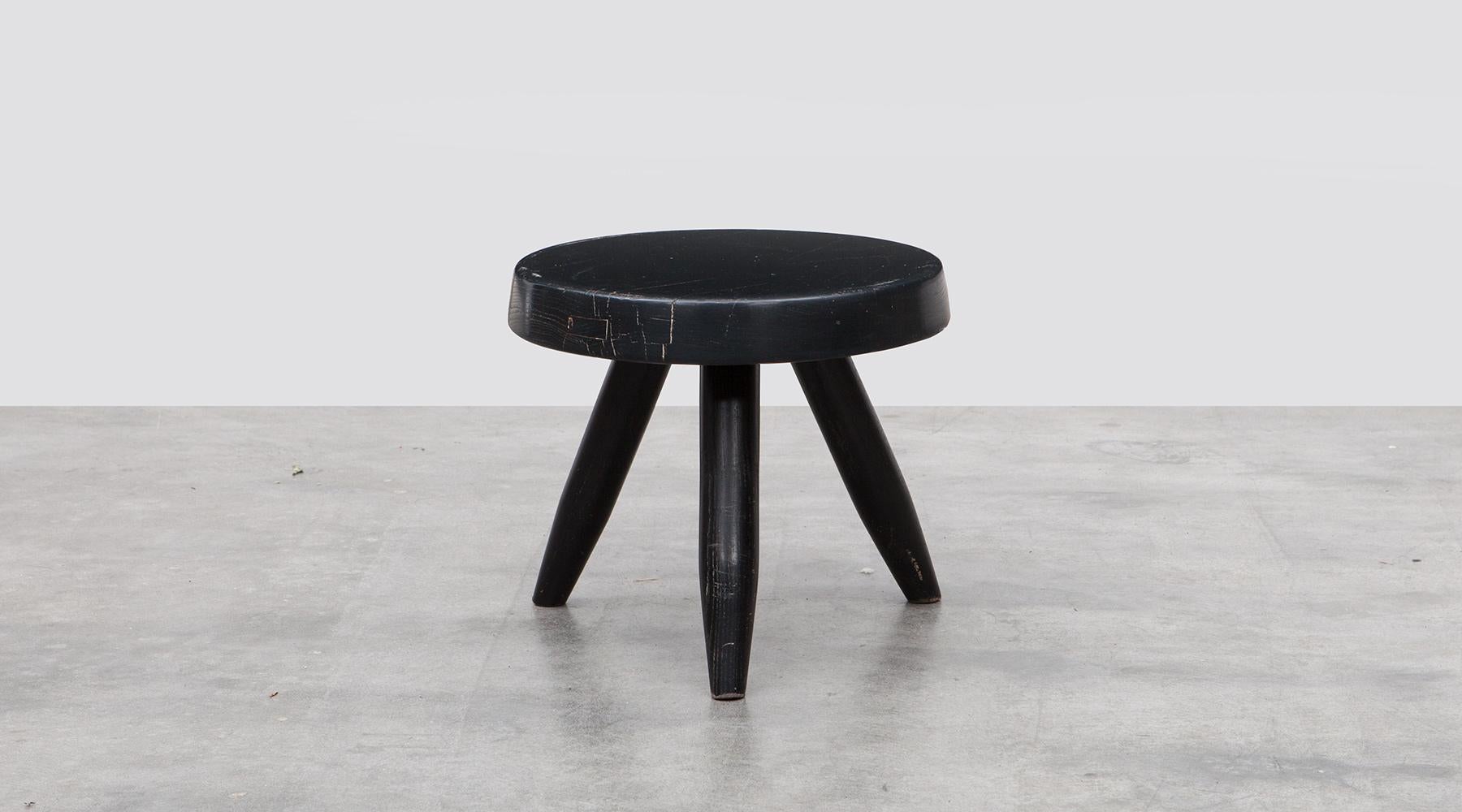 Wooden stools by Charlotte Perriand for Steph Simon, France, 1950.

Beautiful black wooden stools on the typical tripod base, designed by Charlotte Perriand.
The stool is made of oak and has the typical Perriand connection on it's tripod base.