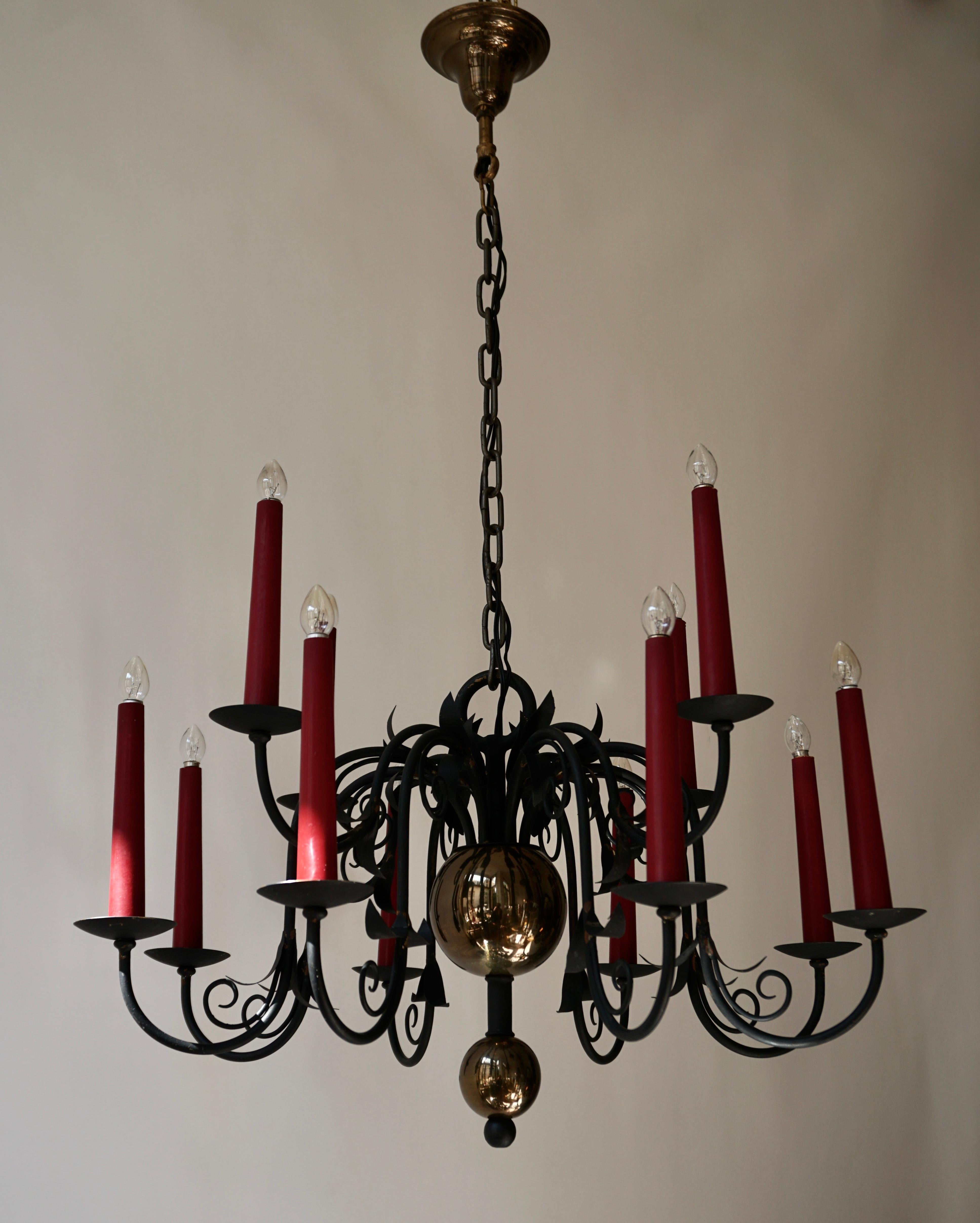 Belgian 1950s Black Wrought Iron Gothic Chandelier with 12 Red Candlesticks