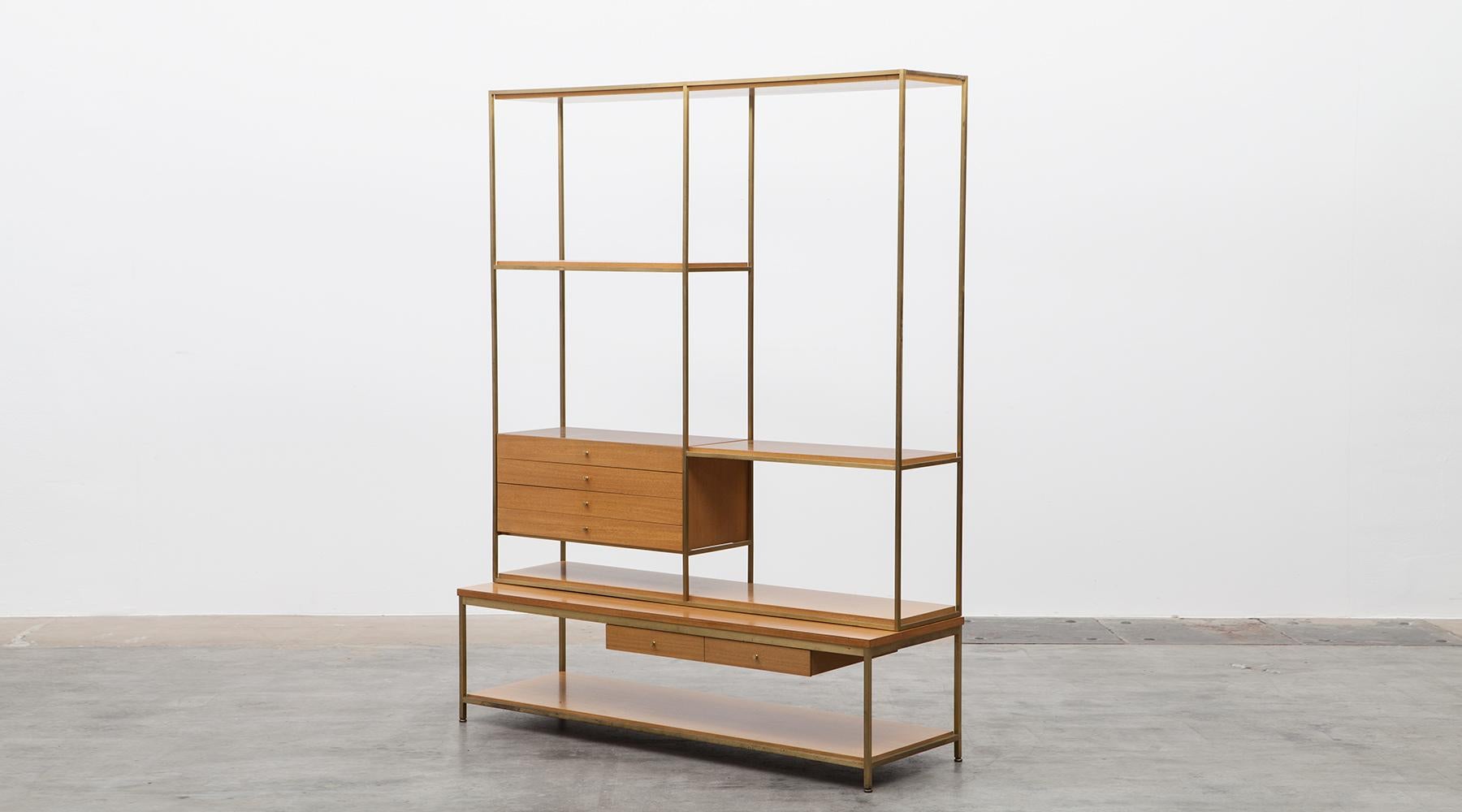 Mahogany shelf, brass base by Paul McCobb, USA, 1954.

A timeless shelf designed by American Paul McCobb with a lot of storage spaces. Six drawers in two different sizes and six shelves are hold and bordered by a brass frame. Corpus is in bleached