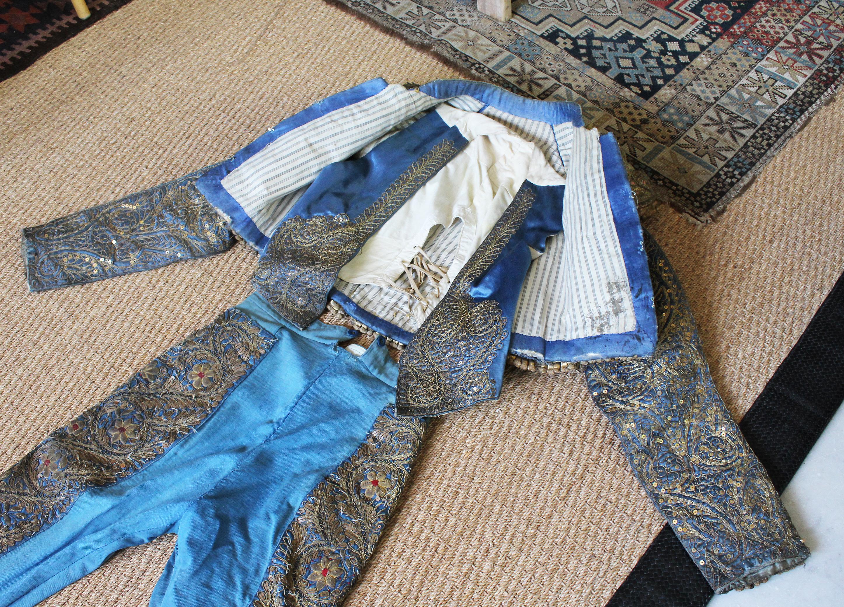 1950s blue Spanish bullfighter traditional outfit with pants and vest embroidered in silver. 

 
