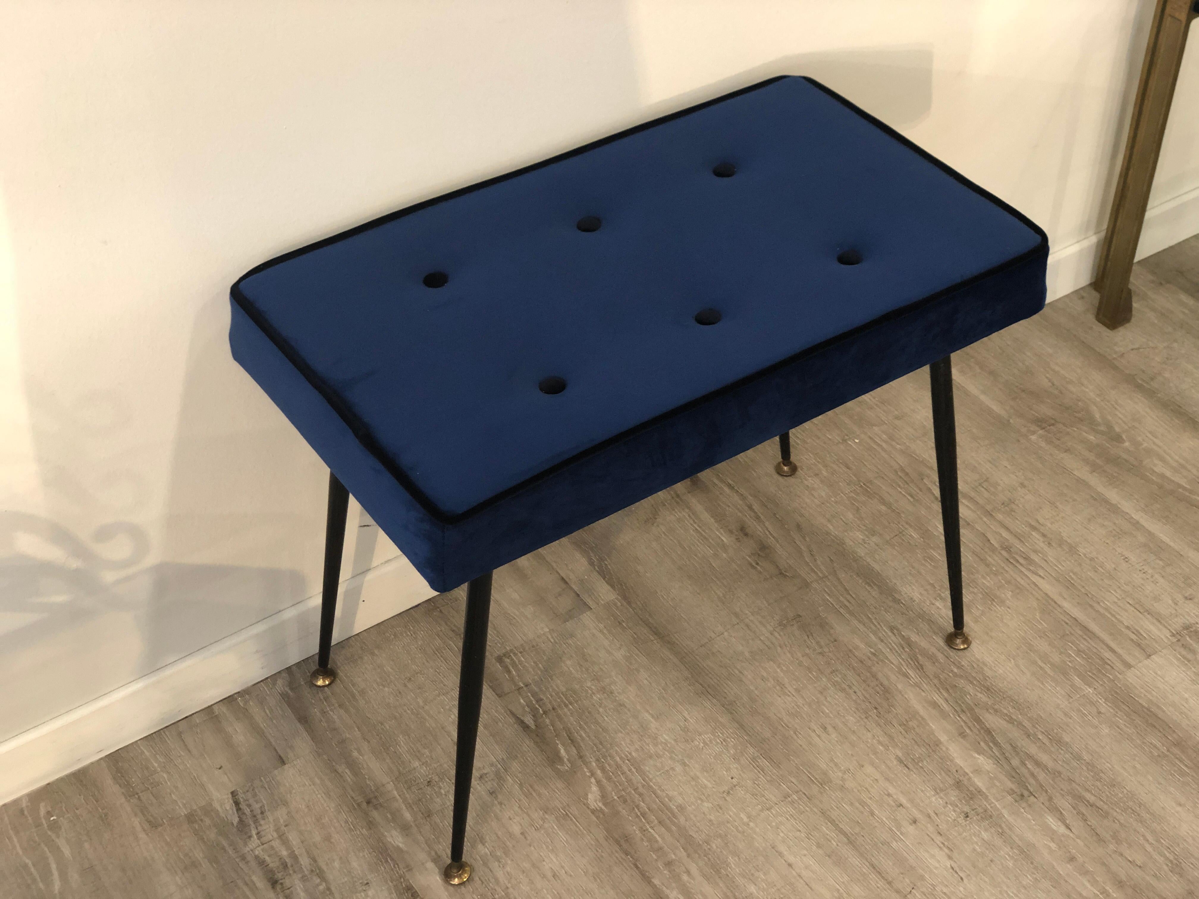 1950s blue velvet black brass ending legs stool. Italian little bench from mid century period. Suitable to be used both as little stool or bench.
We have restored in conservative way the legs, fixing the black lacquer where needed. We have