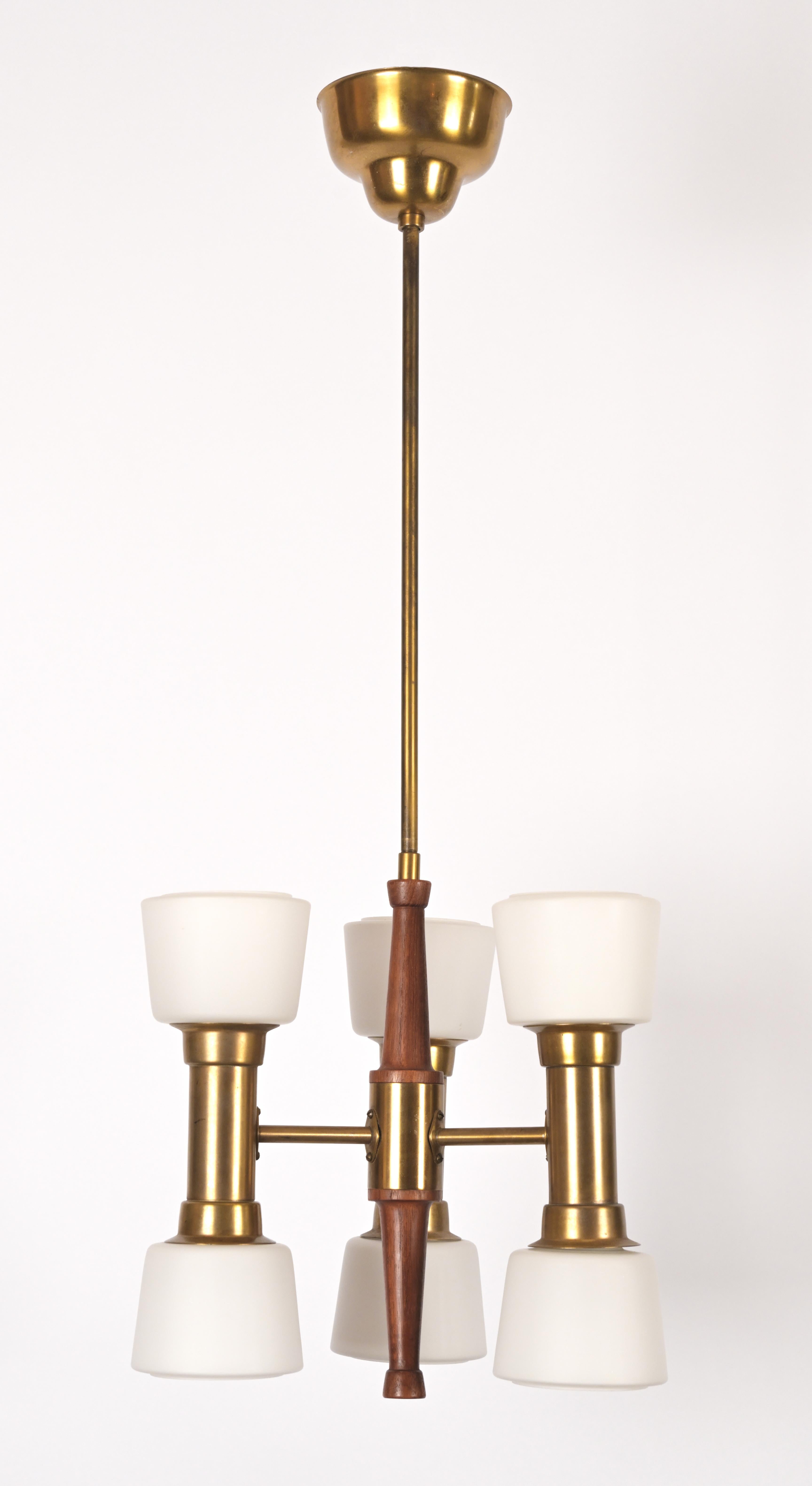 Teak and opal glass pendant light made by Swedish designer Bo Notini (1910-1975) with brass extensions . Contains six sockets. Maximum 40 wattage.