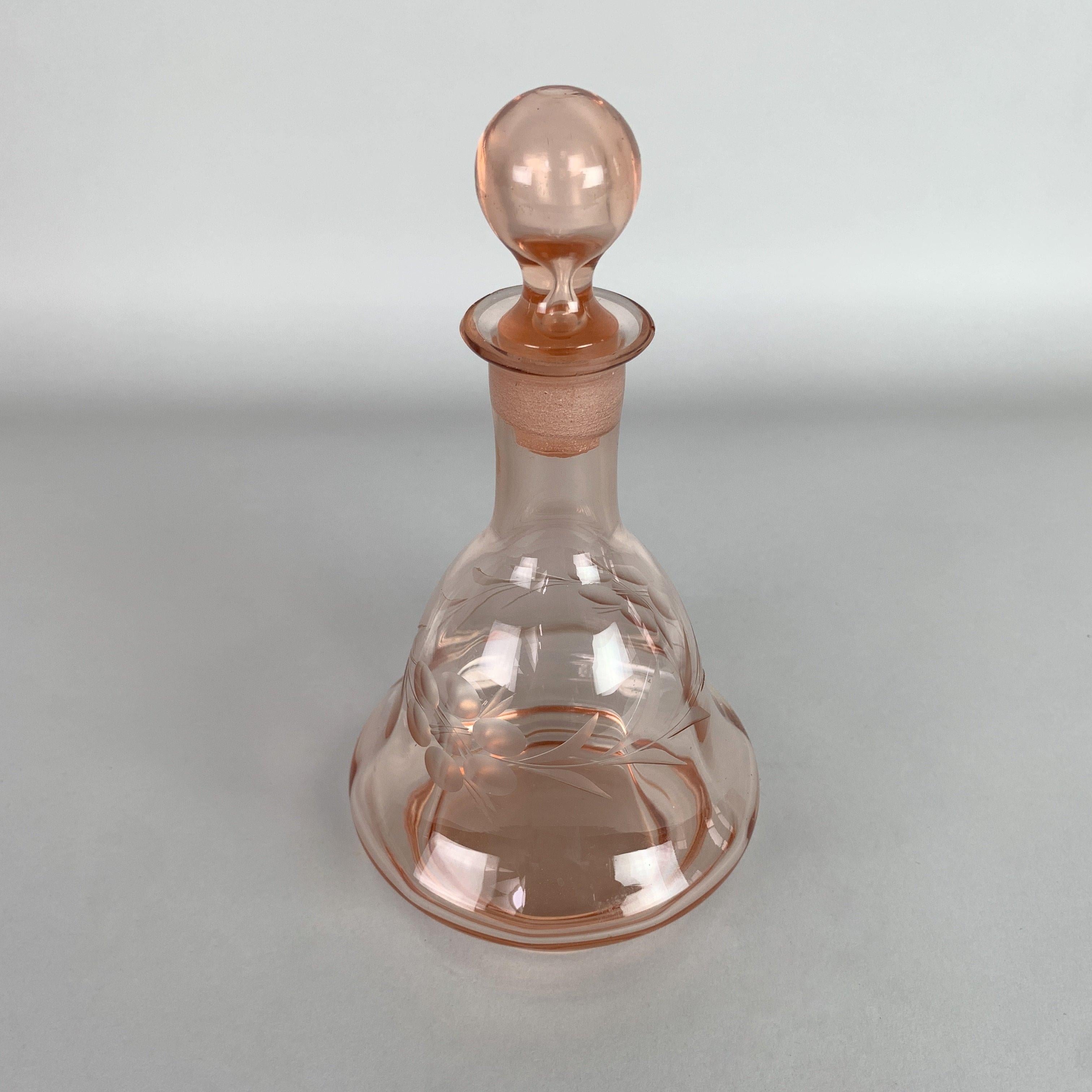 Beautiful bohemian rosaline hand cut glass carafe. There are negligible chips (see photo), which only give the product it's character.